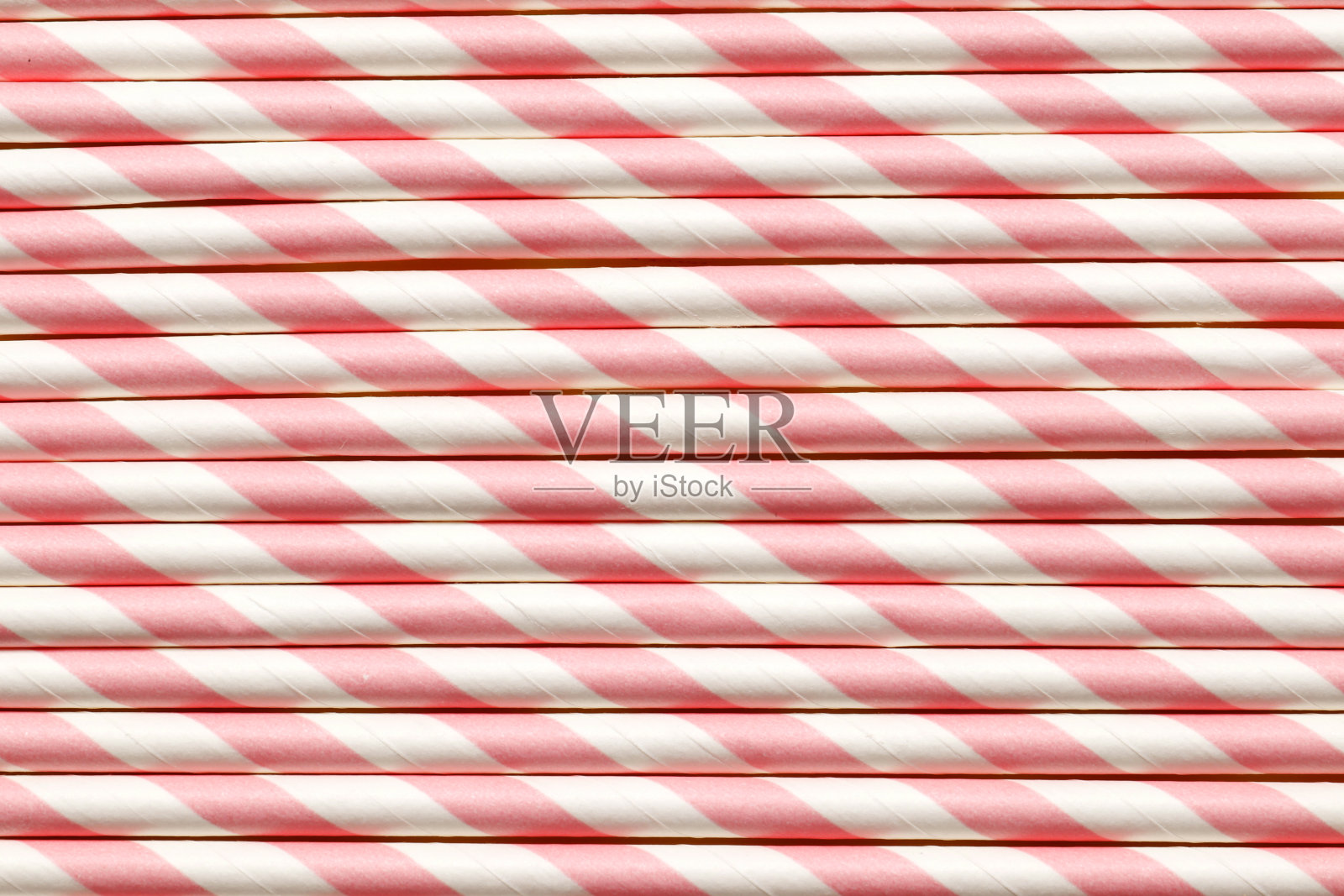 粉红色的纸吸管作为背景照片摄影图片