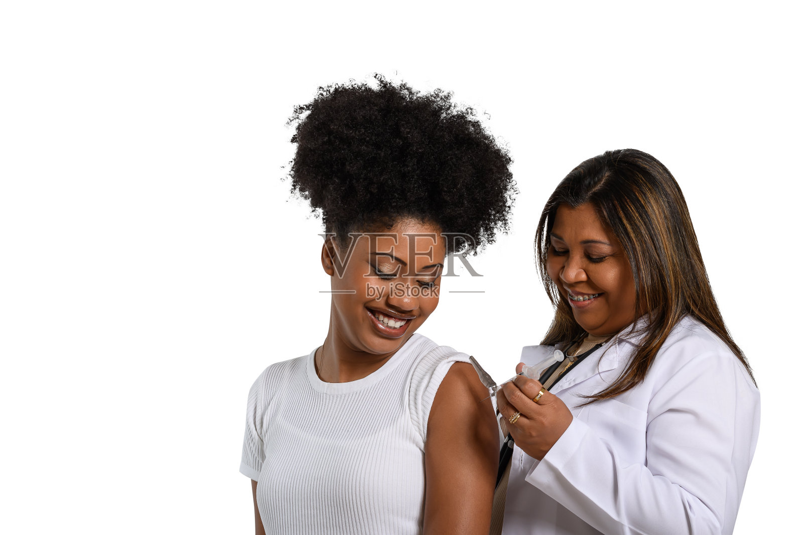 卫生工作者给一个小女孩注射疫苗照片摄影图片