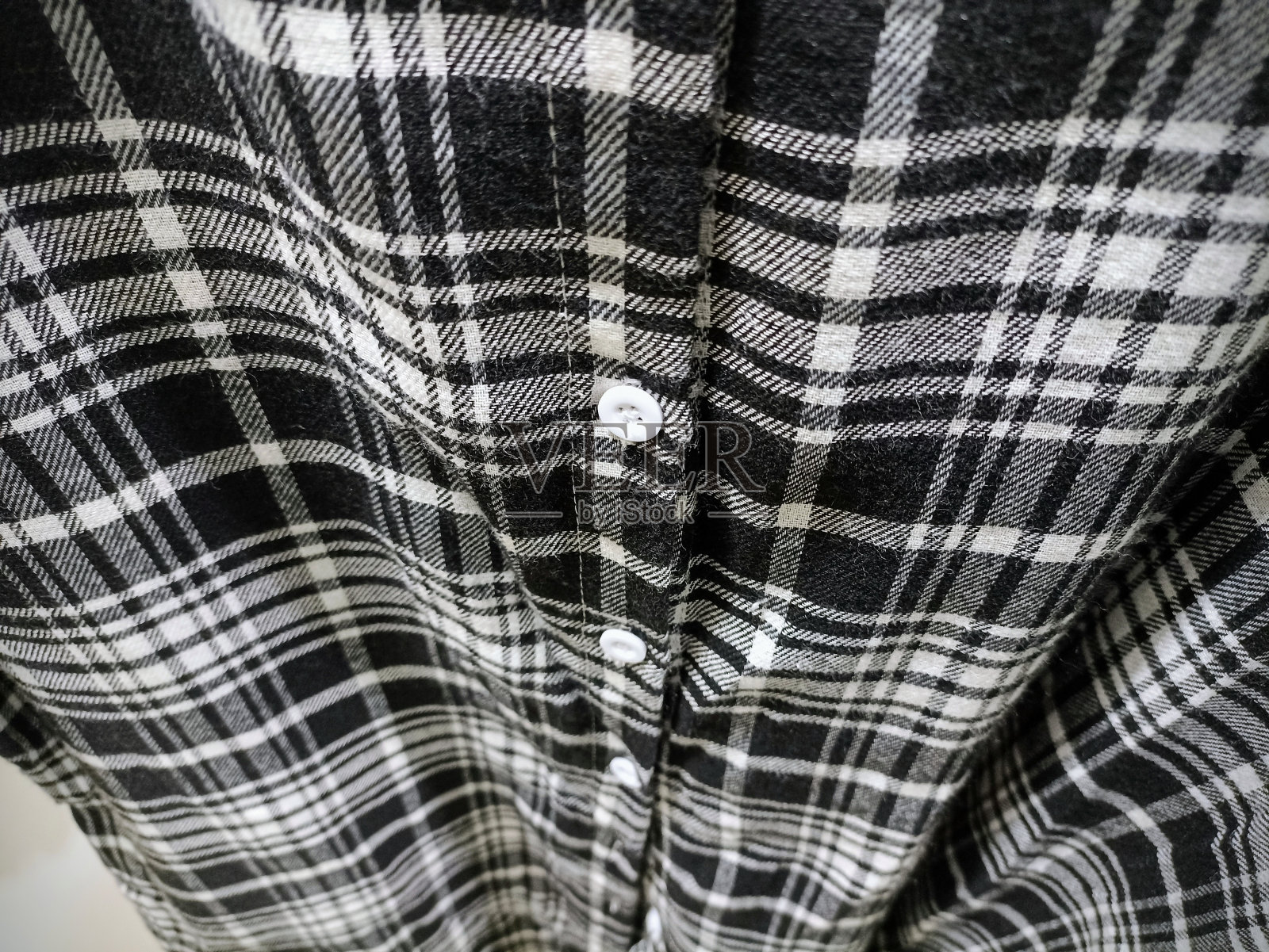 织物纺织抽象背景。方形图案衬衫。照片摄影图片