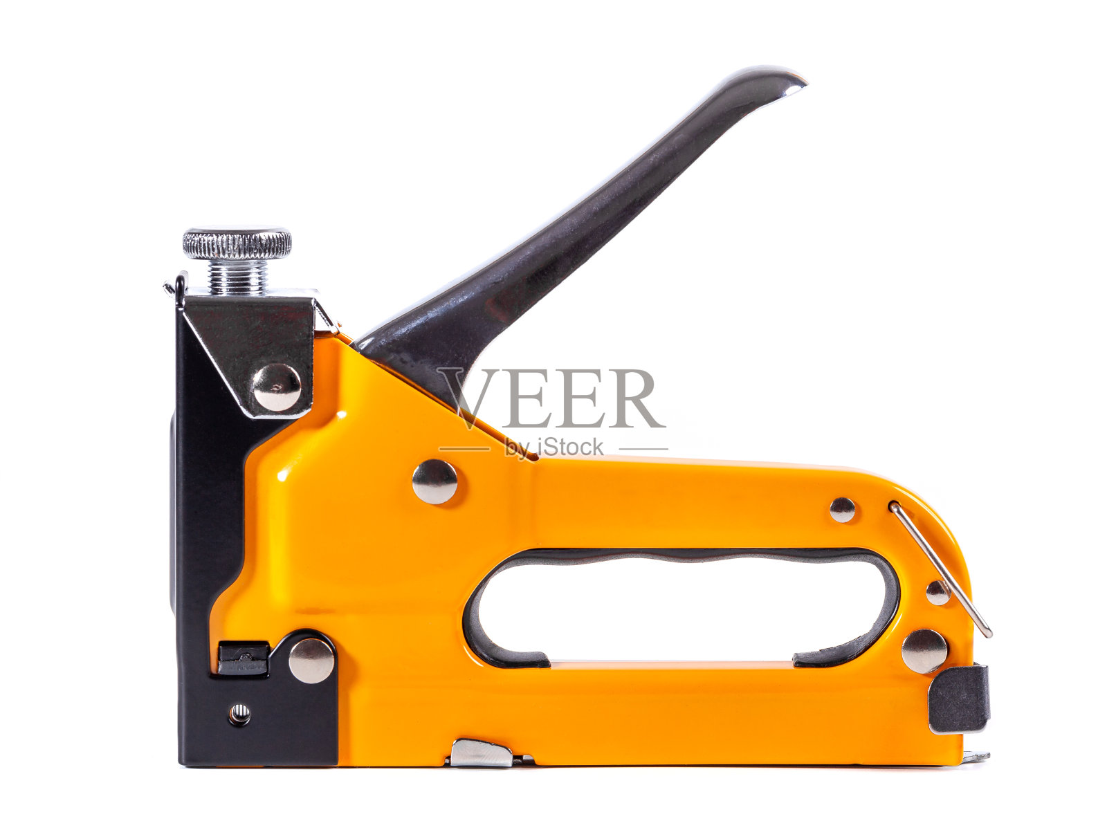 工业订书机，用于在白底上订书钉照片摄影图片