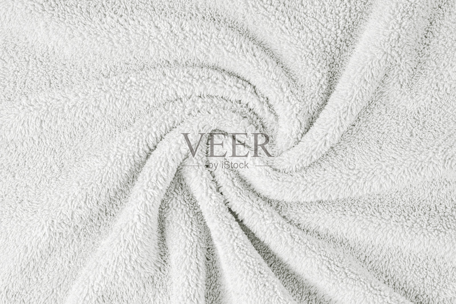 毛巾布，白色毛巾纹理背景。柔软蓬松的纺织浴巾或沙滩巾材料照片摄影图片