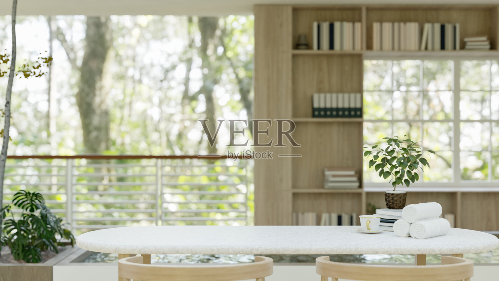 在现代明亮的客厅里，在桌子上复制空间，里面有木制的内置书架照片摄影图片