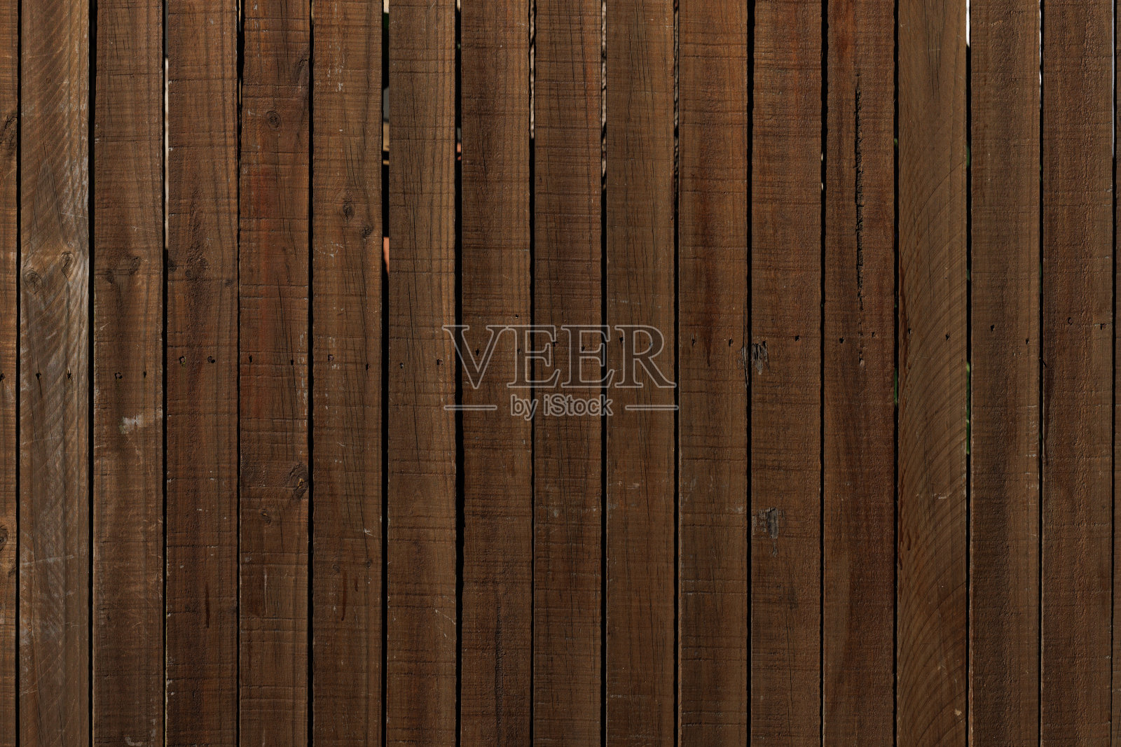 旧的棕色木栅栏的一部分照片摄影图片