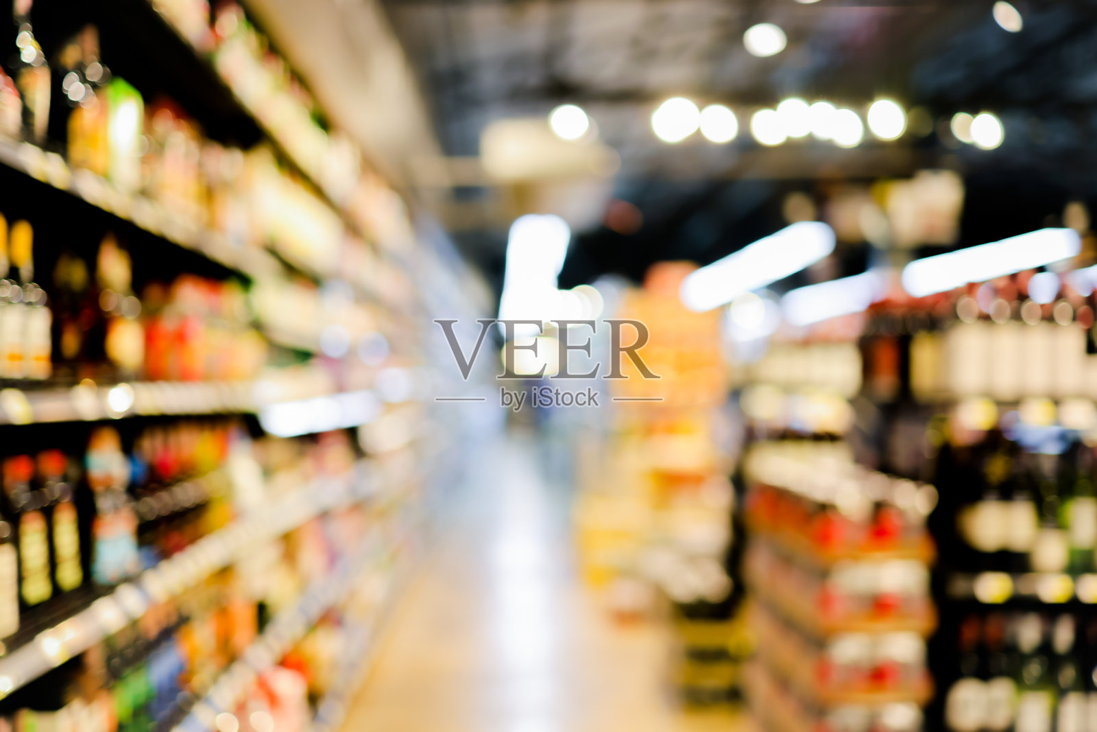 摘要模糊超市零售为背景。照片摄影图片