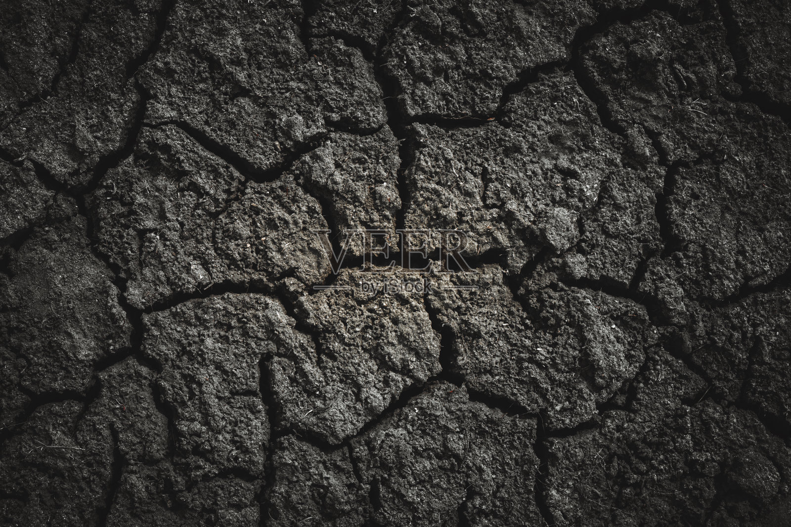 黑色干裂土，底色纹理照片摄影图片