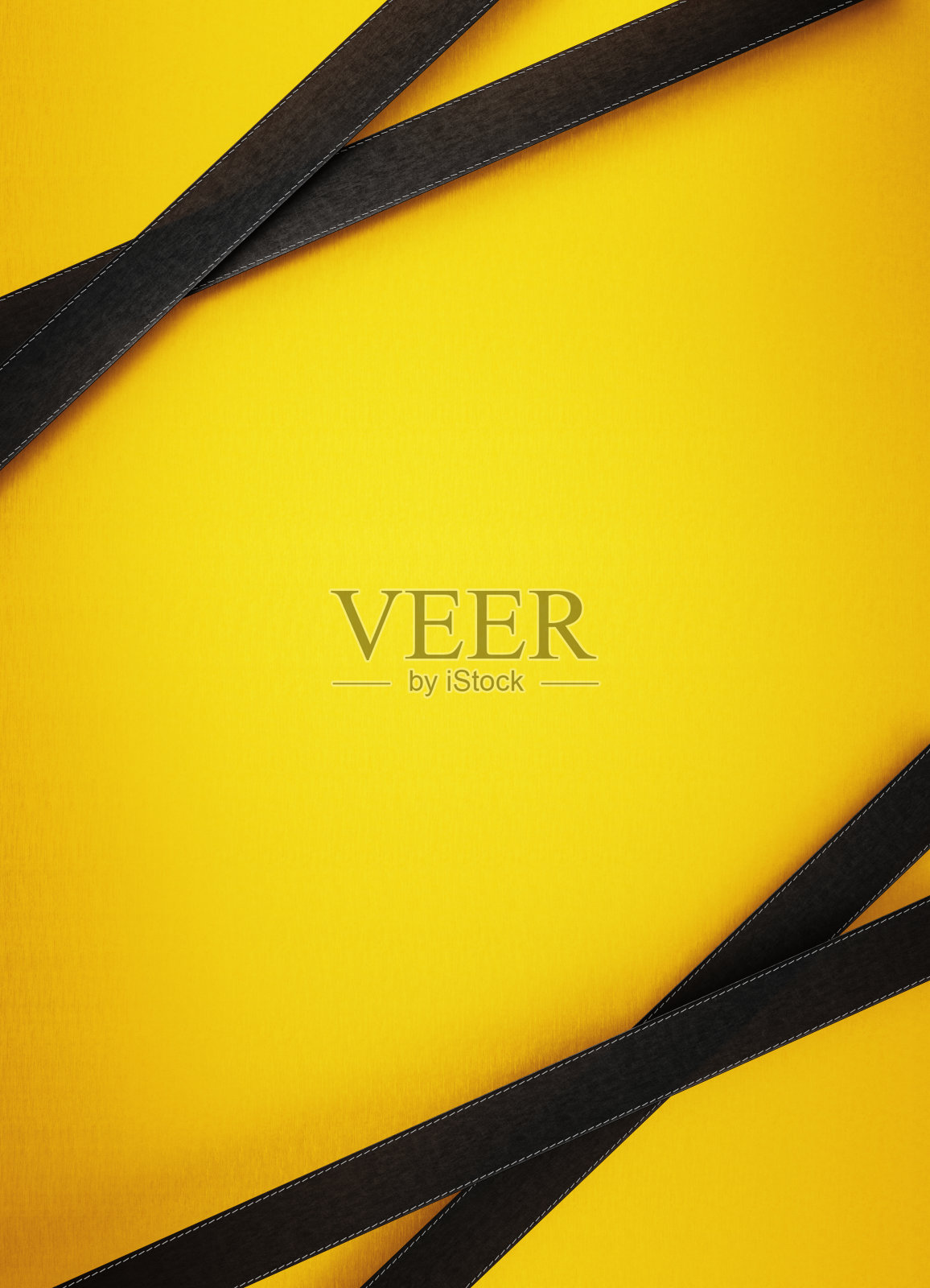 黄色背景上的黑丝带照片摄影图片