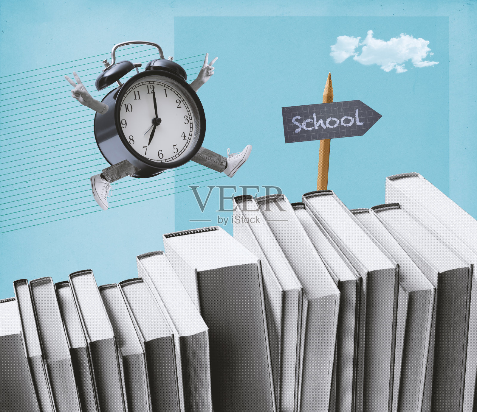 老式闹钟在书本上奔跑照片摄影图片