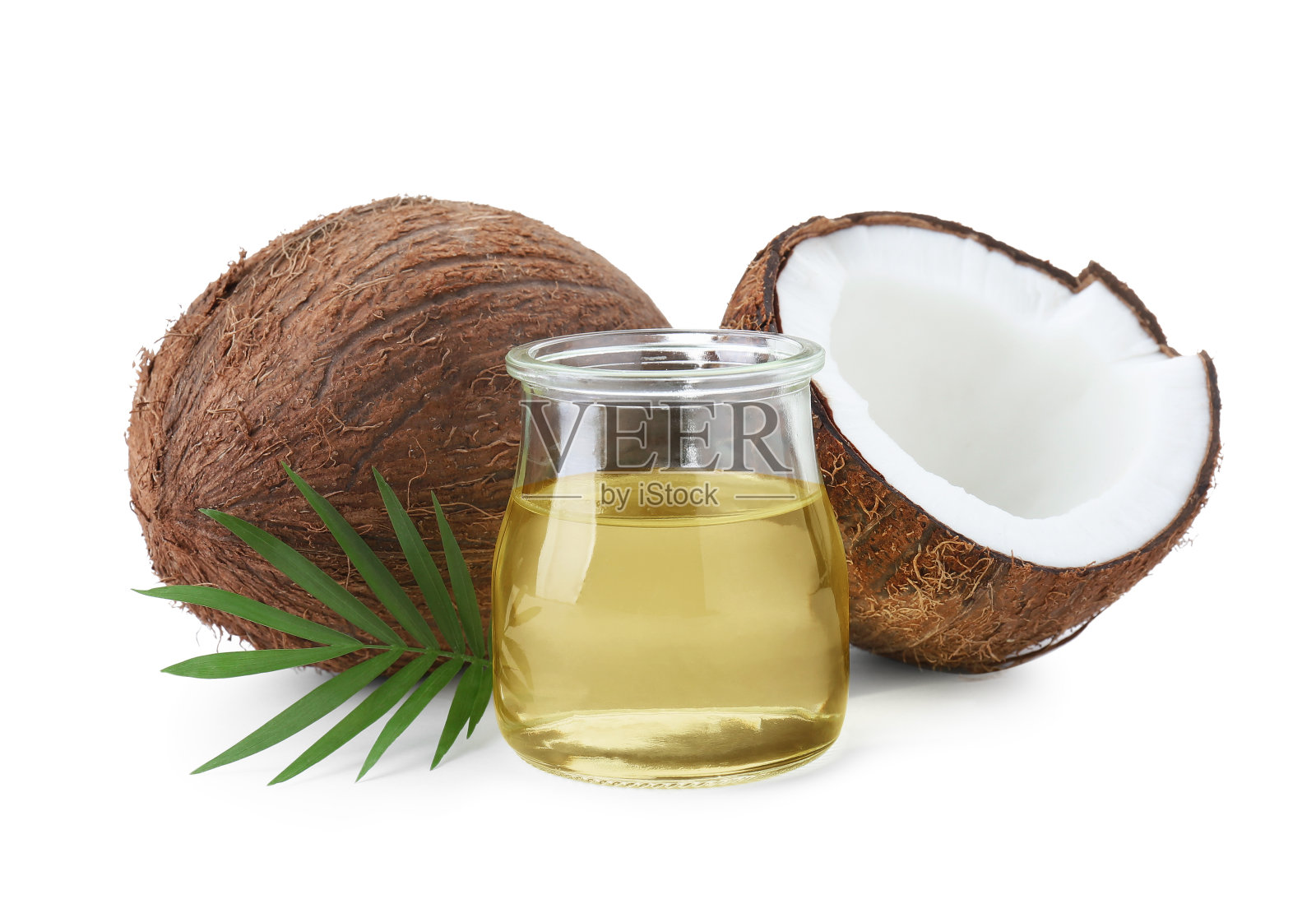 有机椰子烹调油，新鲜水果和叶子上隔离白色照片摄影图片