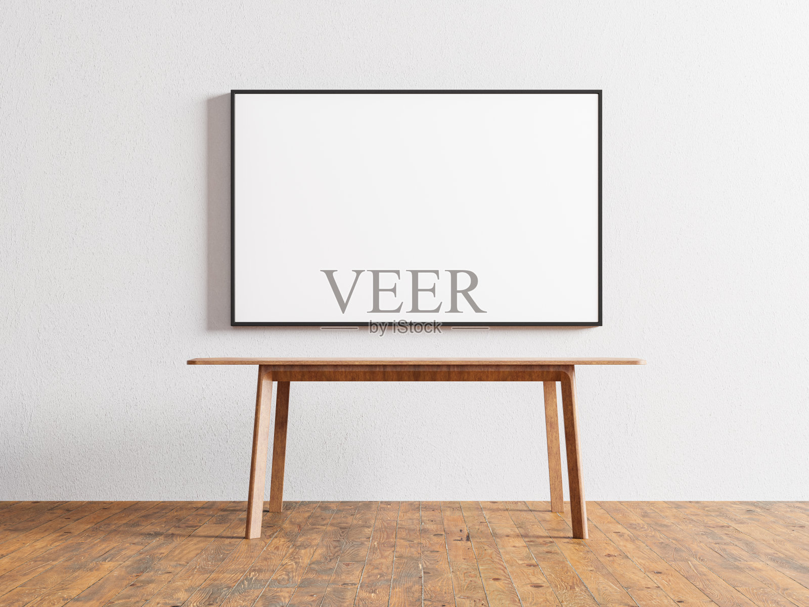 室内是木地板，白色墙壁上有空的相框和靠墙的木桌照片摄影图片