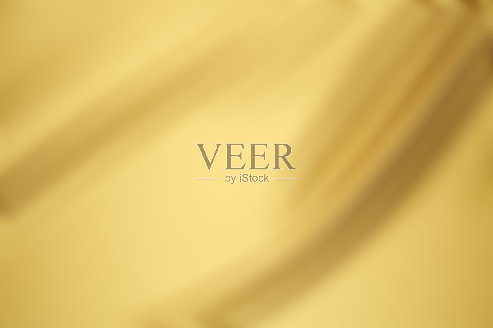 散焦皱巴巴的金色缎面纹理背景与复制空间照片摄影图片