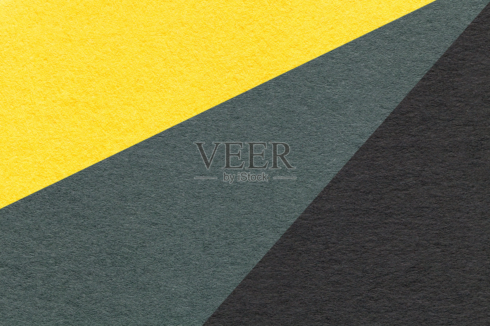 纹理老工艺黄、墨绿色和黑色的彩色纸背景，宏观。复古抽象纸板照片摄影图片