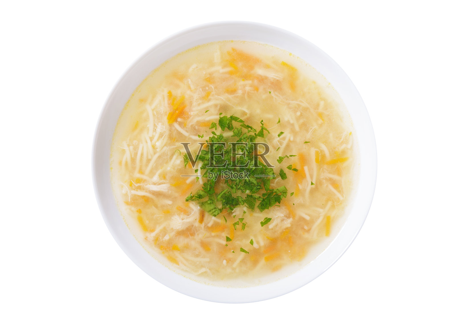 一盘白底的鸡肉和欧芹面汤照片摄影图片