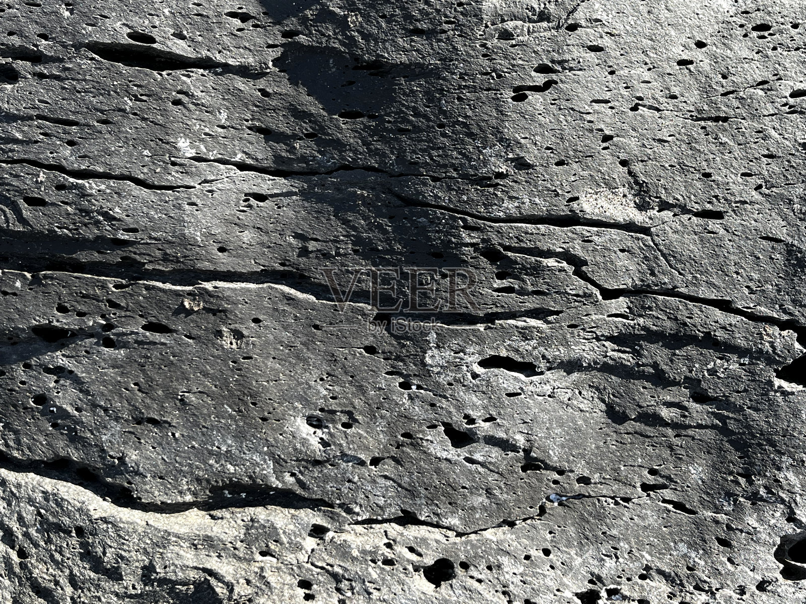 火山喷发的岩石细节和小孔照片摄影图片