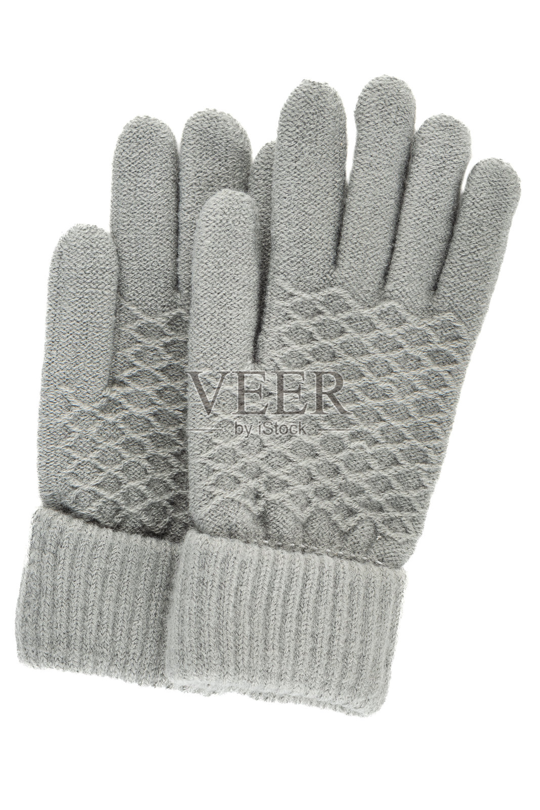 垂直灰色的妇女针织冬季手套孤立在一个白色的背景。照片摄影图片