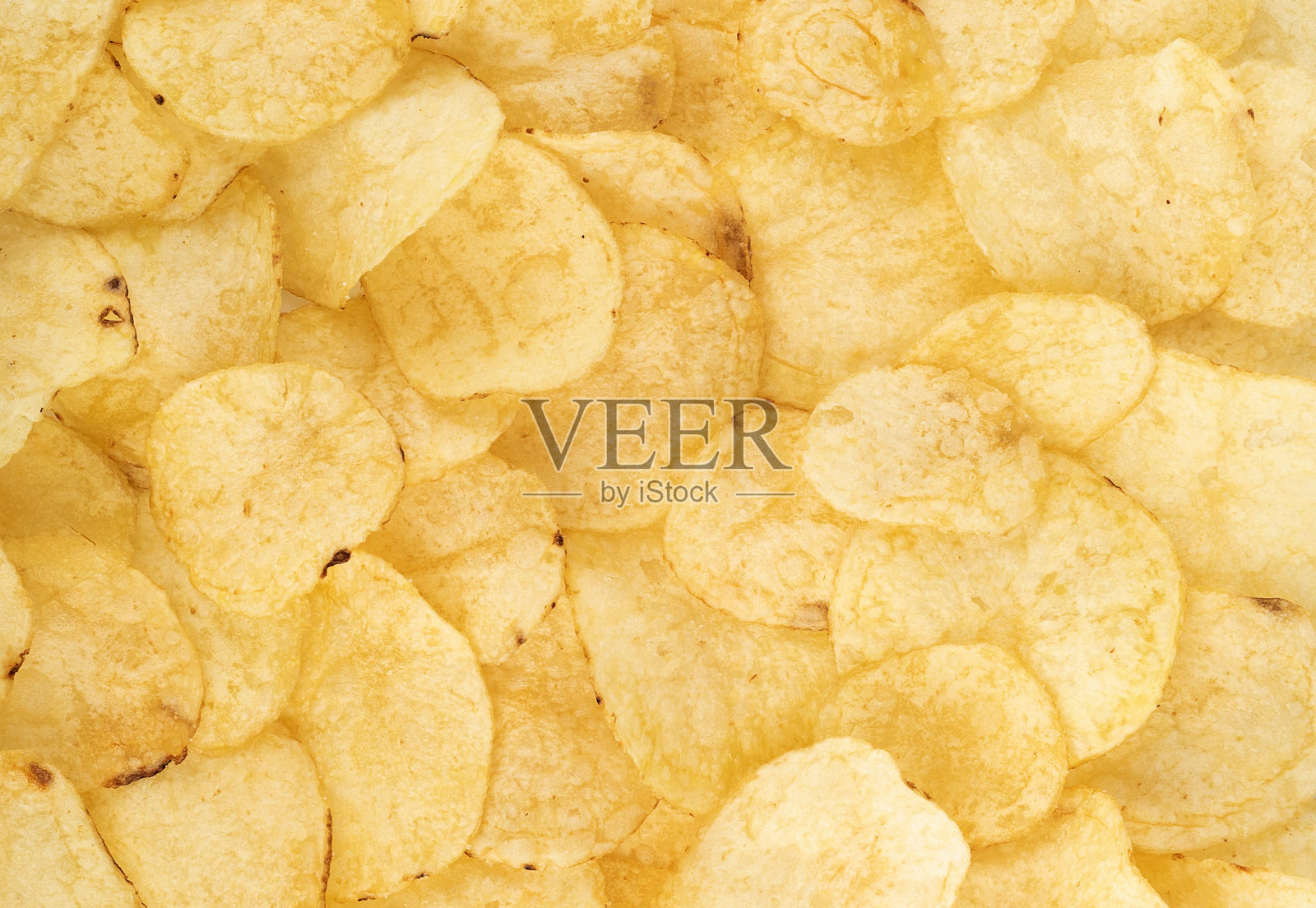 食物背景是脆脆的天然薯片。照片摄影图片