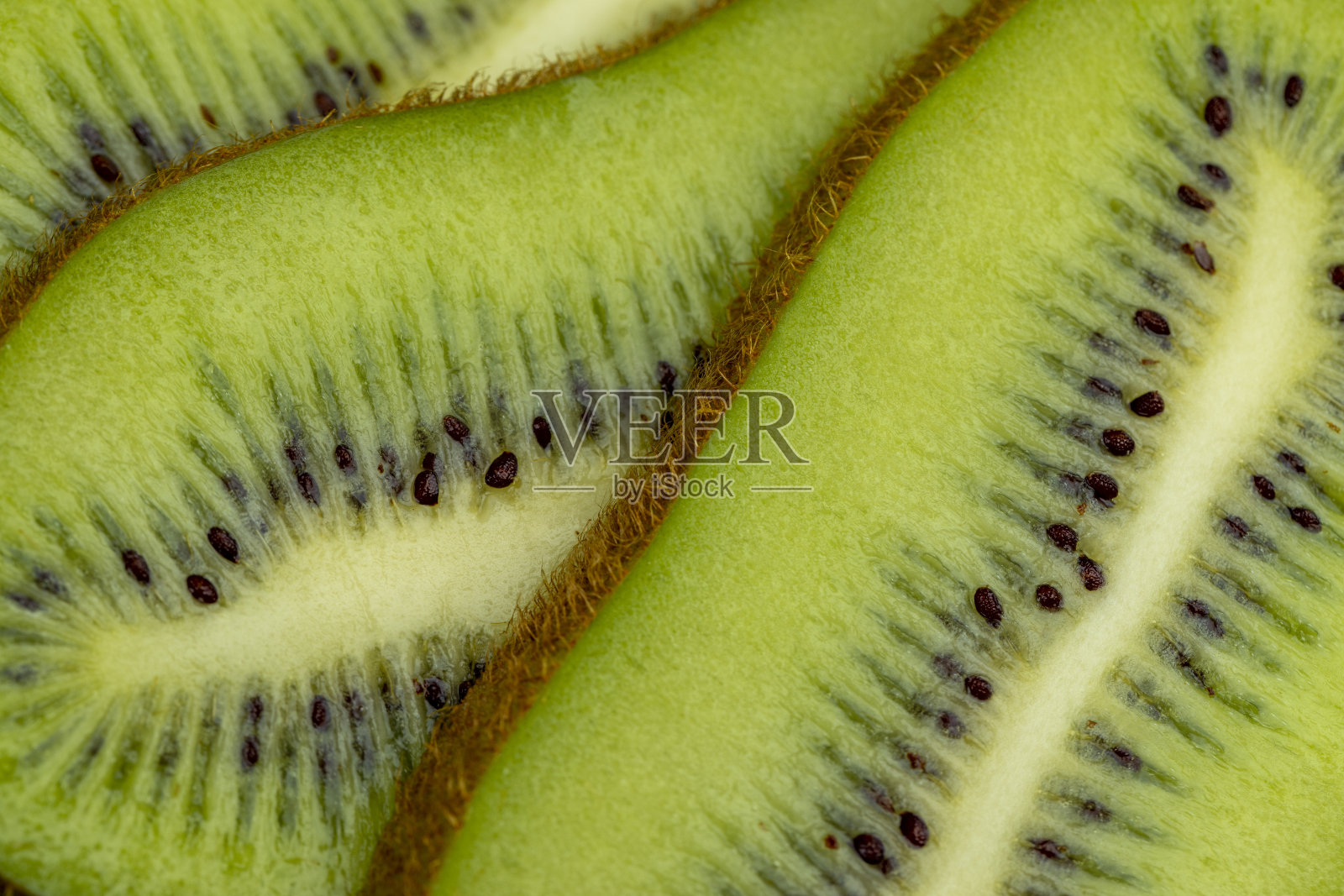 成熟的绿色猕猴桃切成薄片照片摄影图片