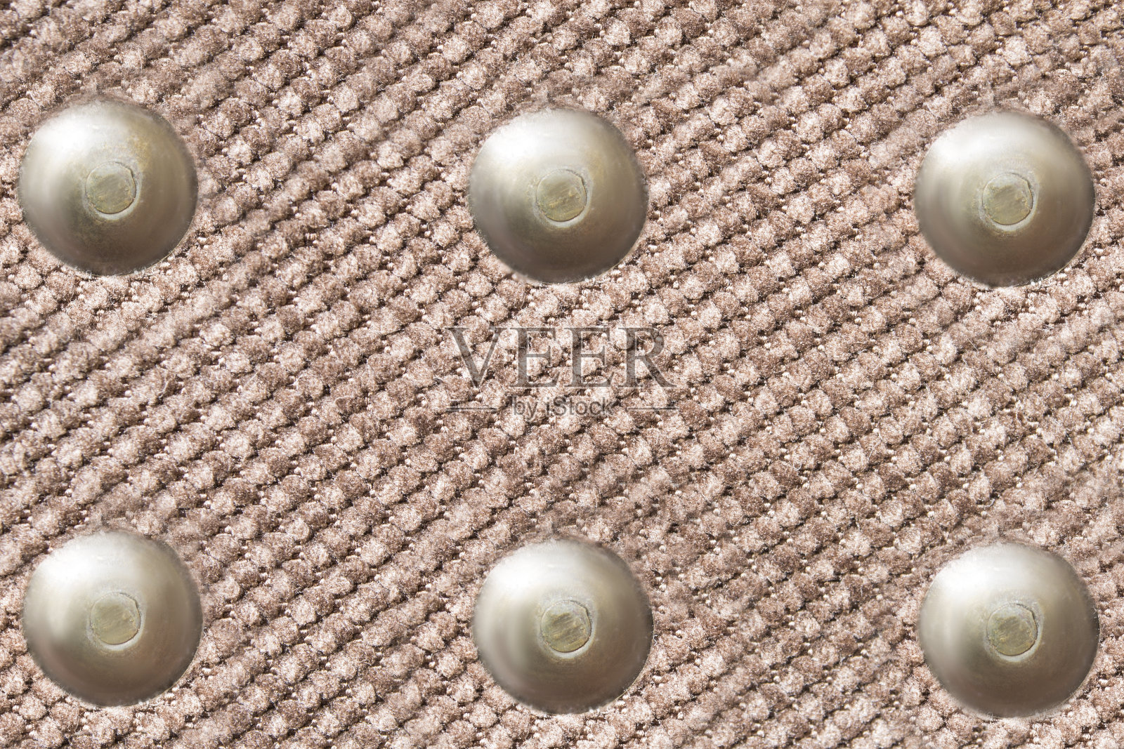 织物上的铆钉特写照片摄影图片