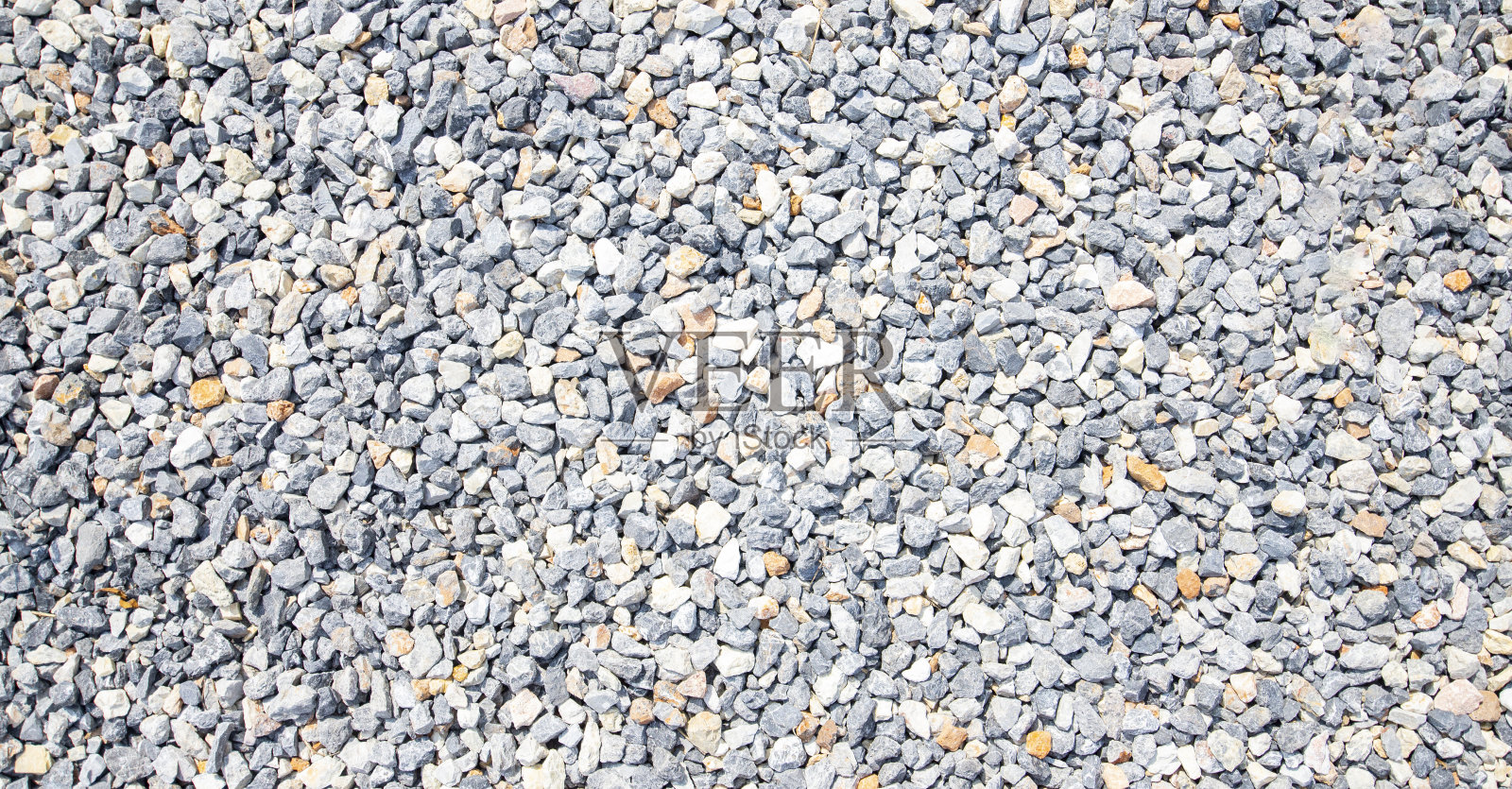 区域图案白色，灰色，黑色鹅卵石。照片摄影图片