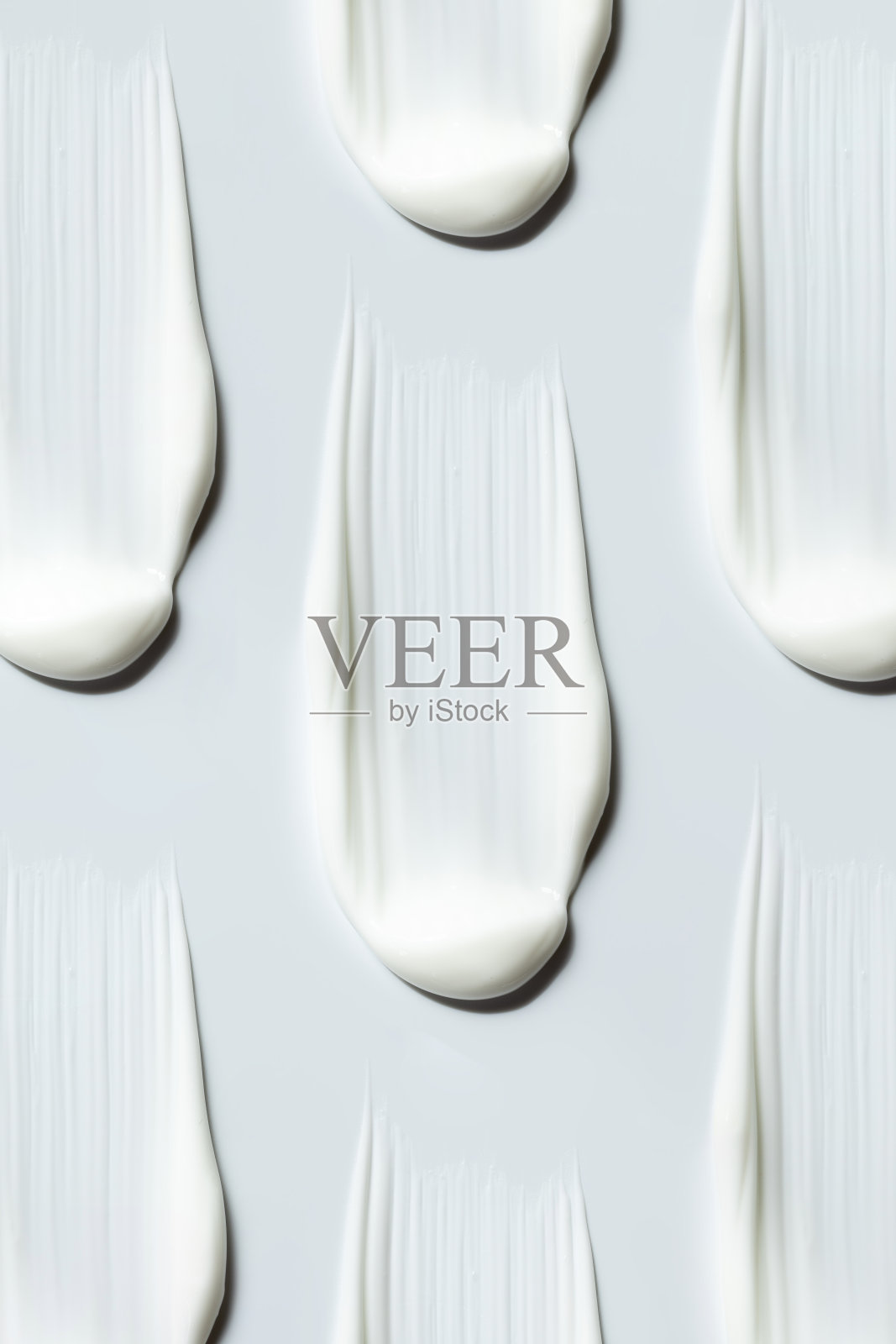 灰色背景上的奶油状纹理图案照片摄影图片