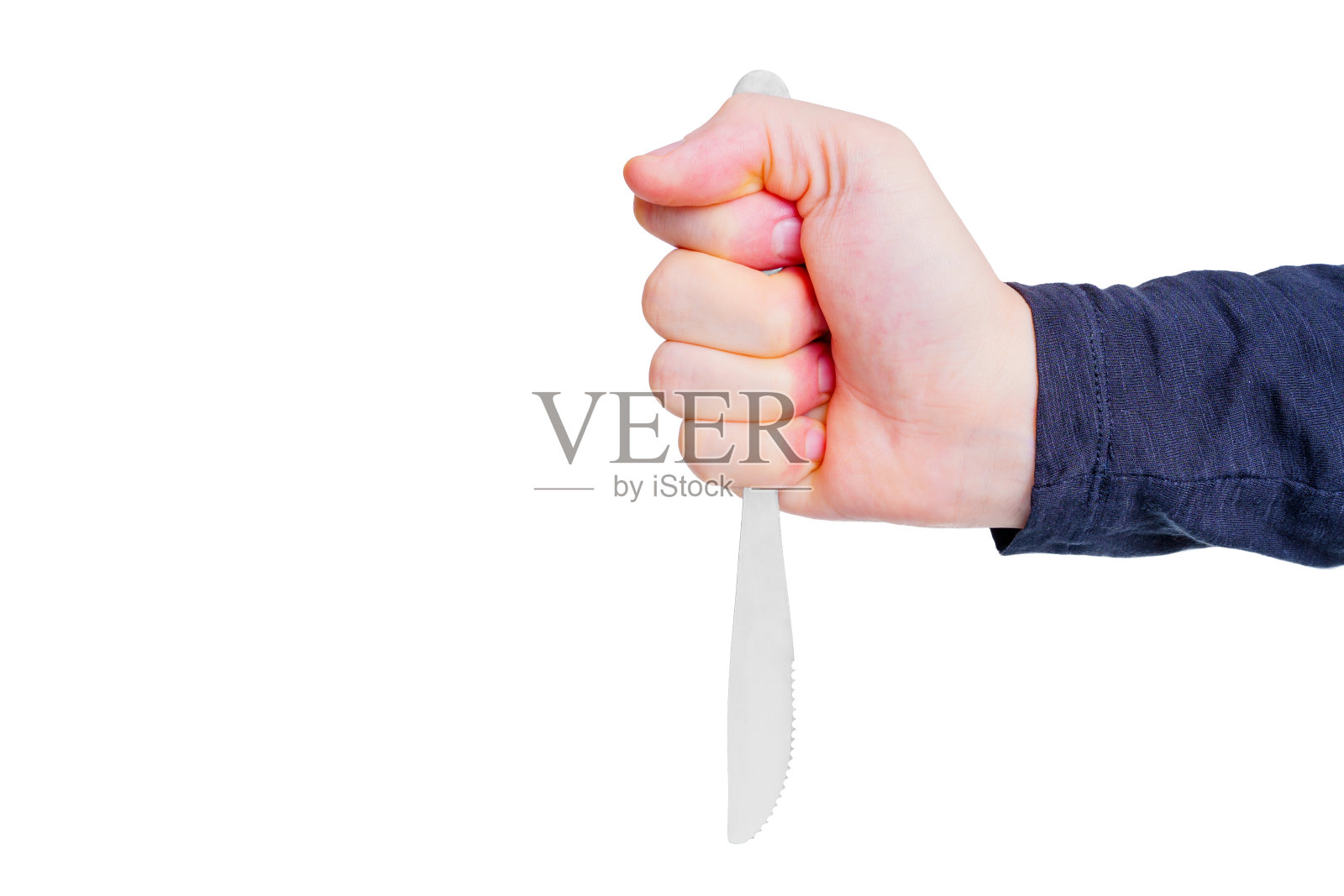 一只手紧紧握着刀的特写照片摄影图片