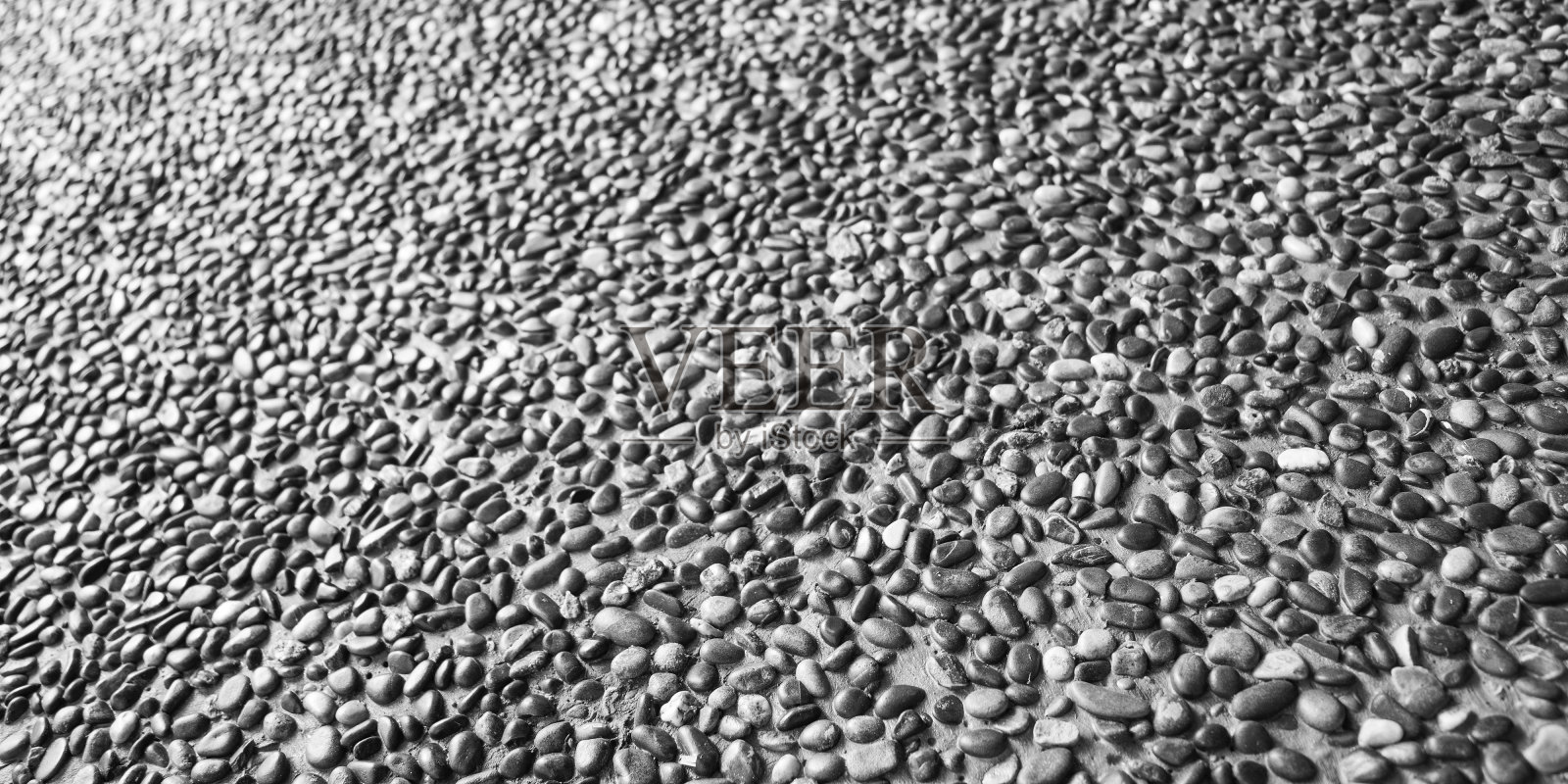 天然鹅卵石背景，路面，黑白石材质感照片摄影图片