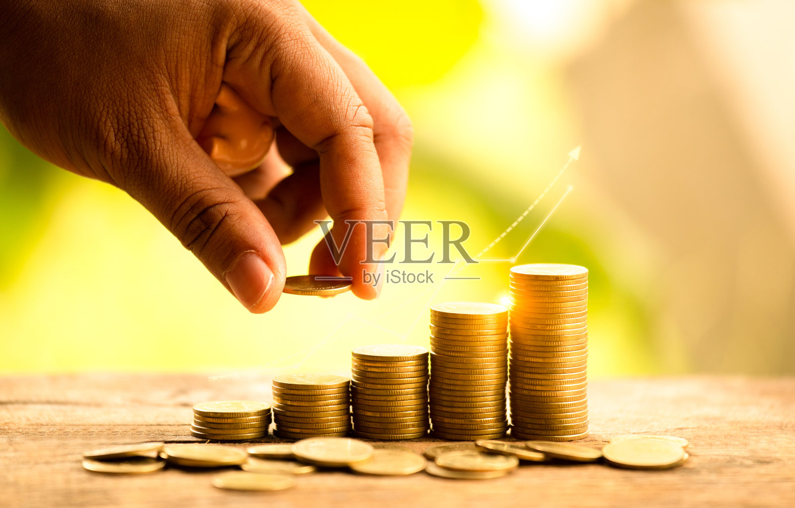 成长的想法或省钱的概念。成功的企业管理。投资图表。硬币背景符号。照片摄影图片