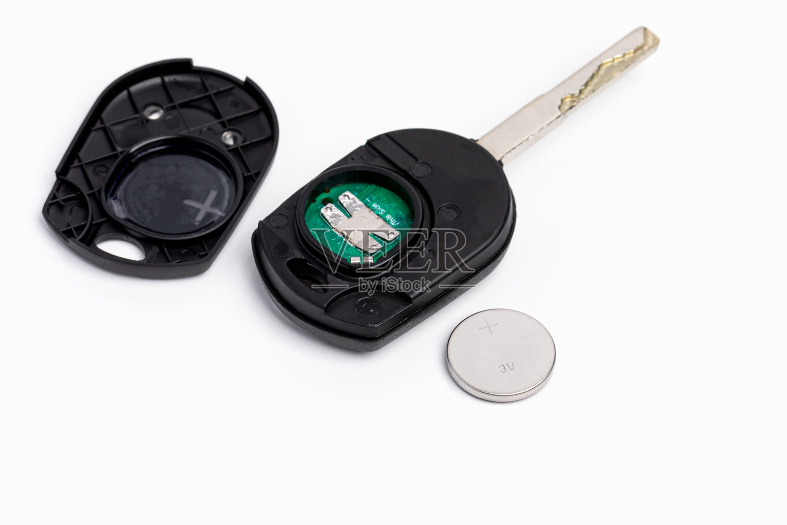 带电池的遥控车钥匙。车辆无钥匙进入，汽车维修保养理念。照片摄影图片