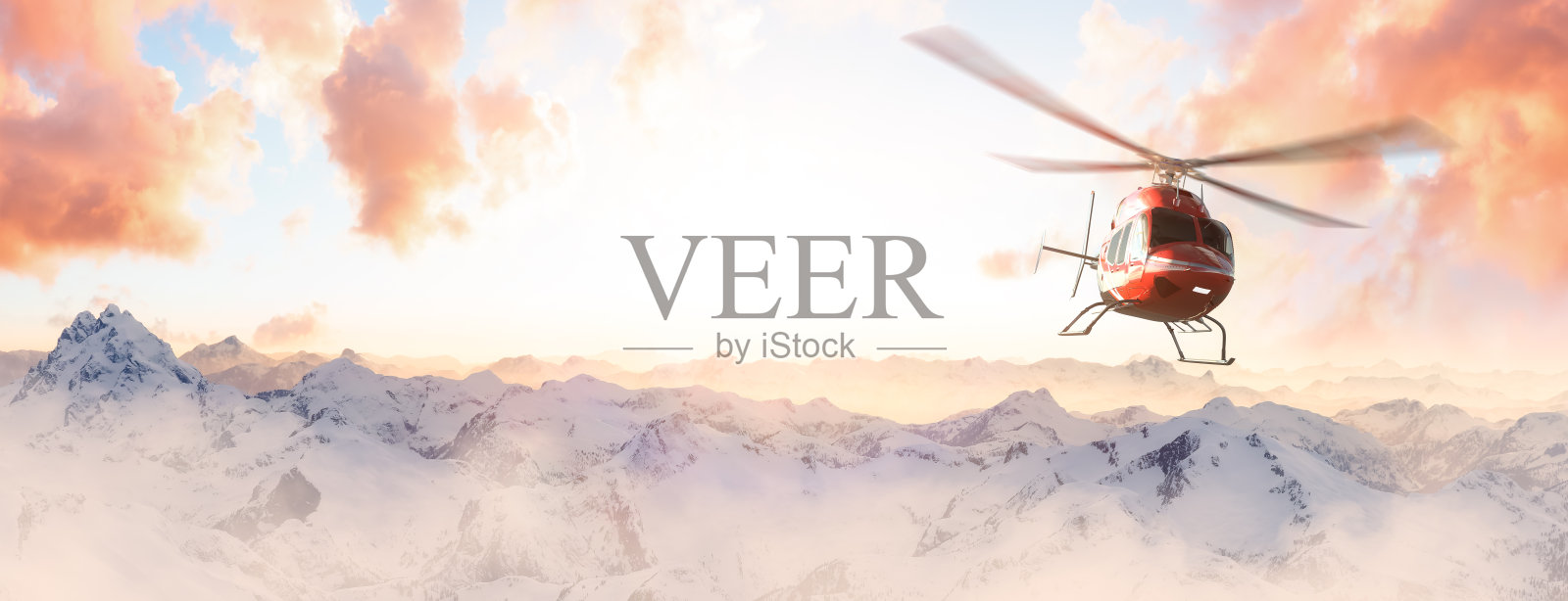 在绚丽的日落时分飞越落基山脉的直升机照片摄影图片