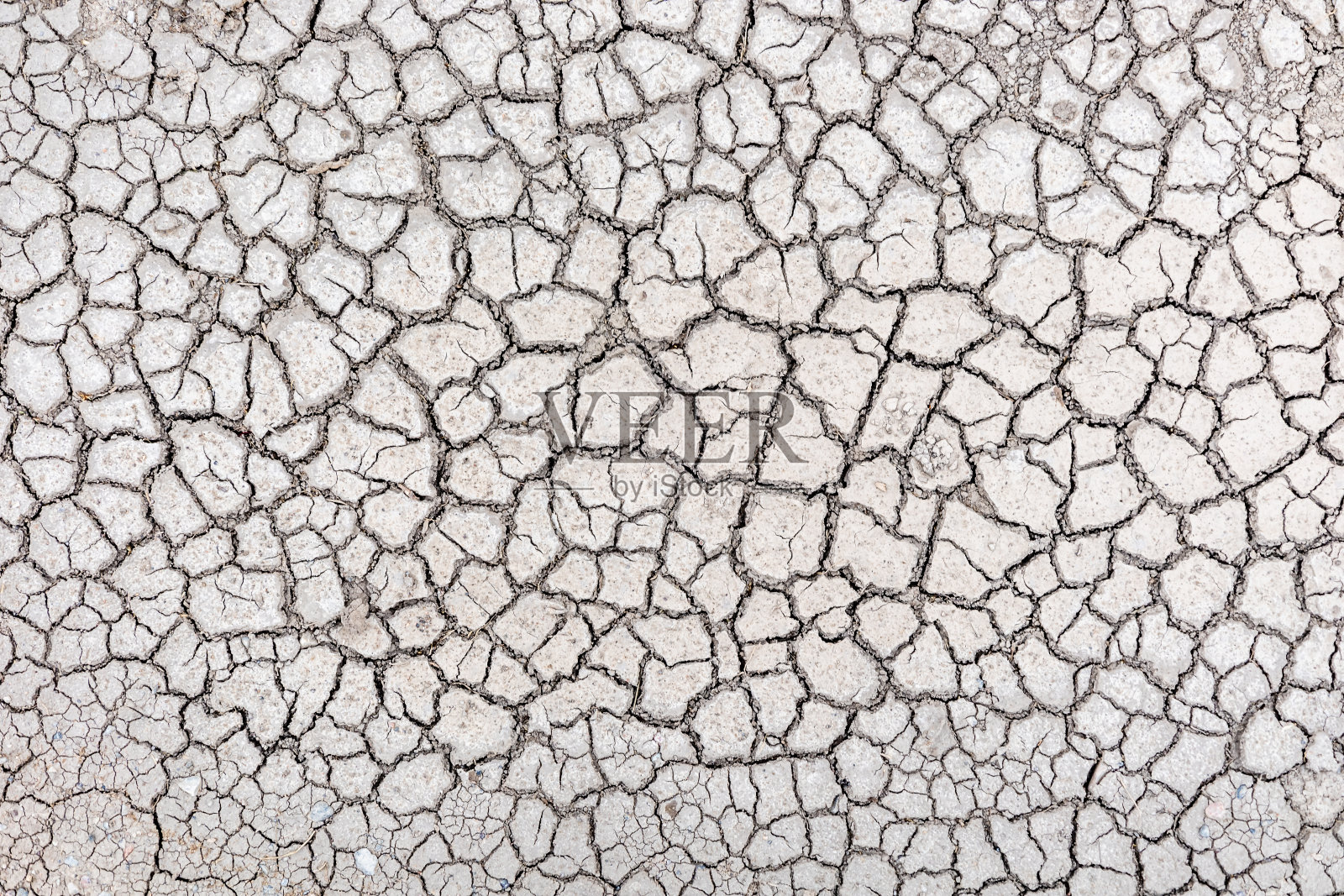 地球与裂缝顶视图为背景或纹理图形设计和覆盖与干旱和死亡的概念。照片摄影图片