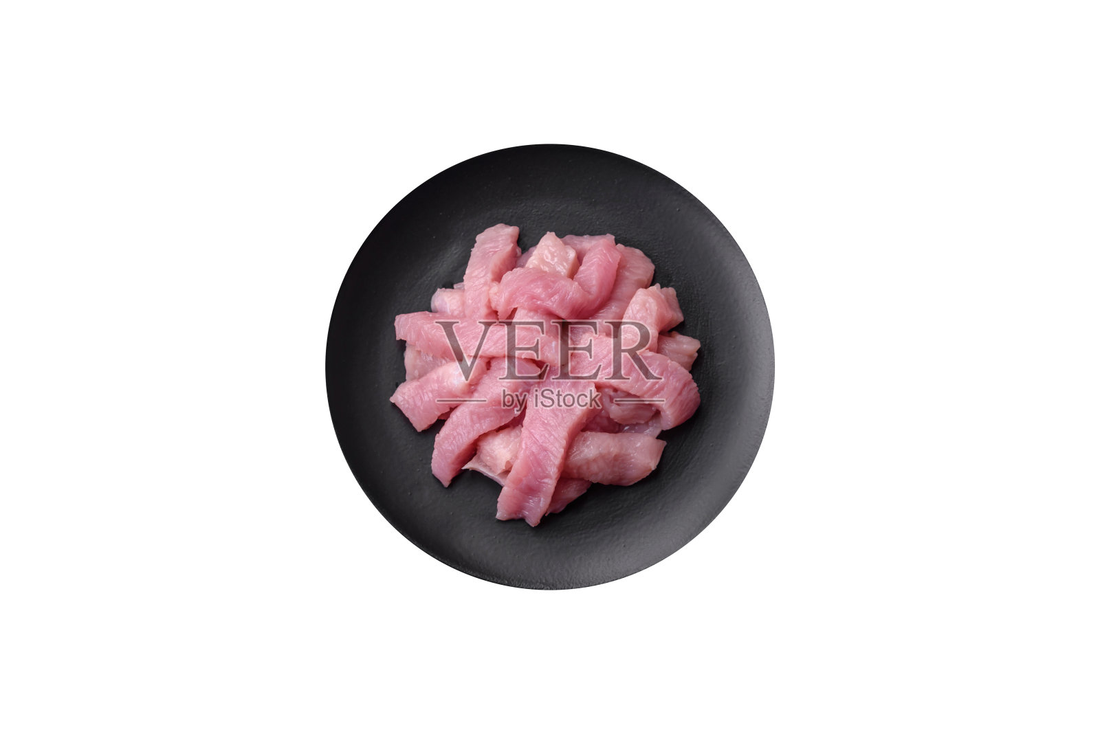 用盐、香料和香草制成的生火鸡肉片照片摄影图片