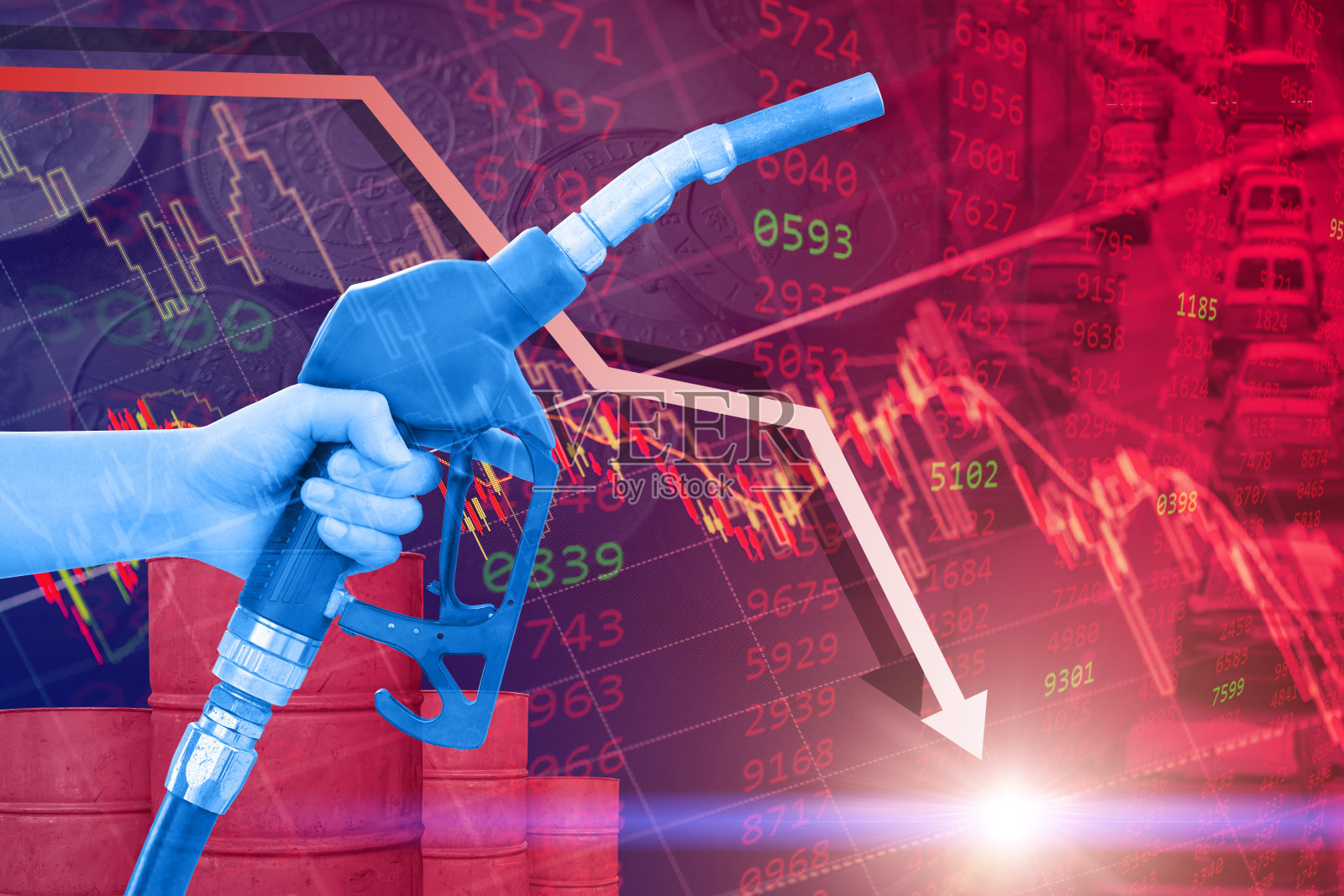 原油零售价格下跌低的负面概念，红色的商业股票图表覆盖手与燃油喷嘴向下箭头。照片摄影图片