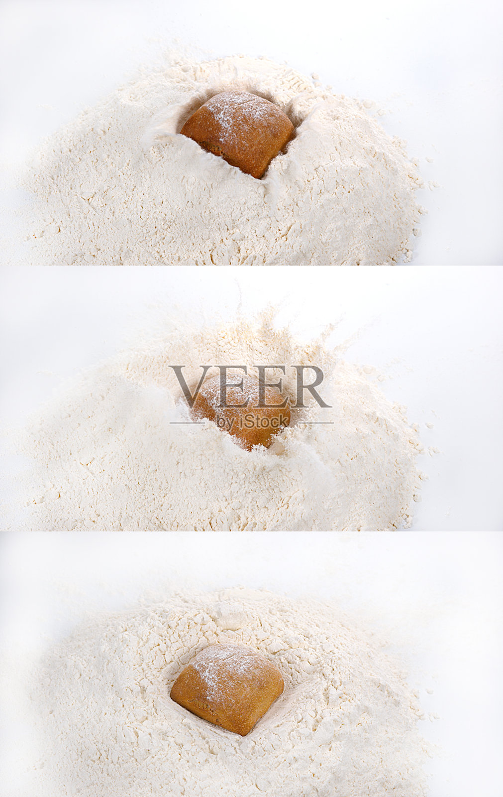 面包落在面粉里，背景是白色照片摄影图片