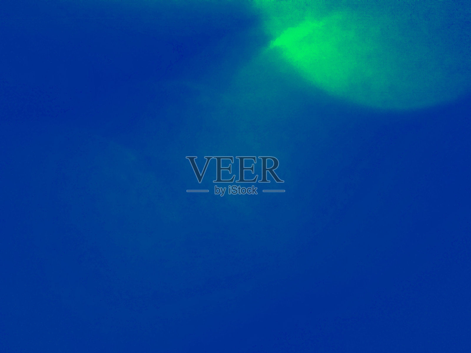 蓝色背景中的绿色照明色照片摄影图片