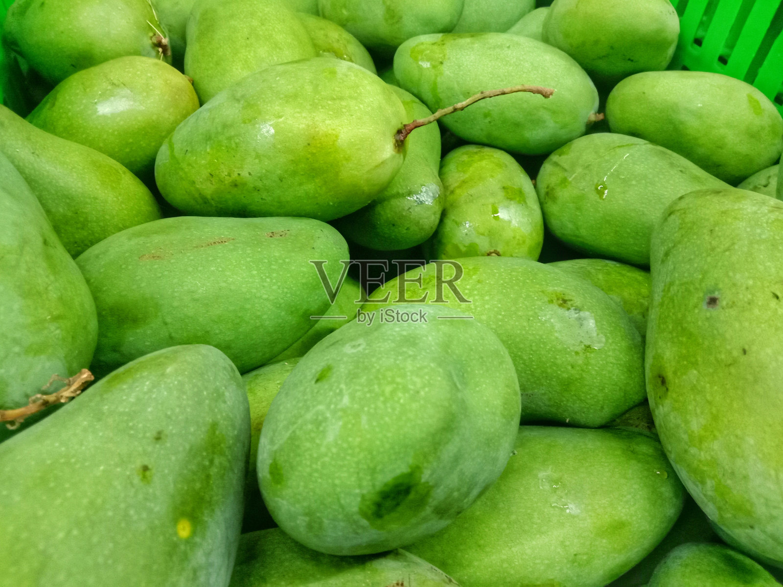 市场上的一堆芒果照片摄影图片