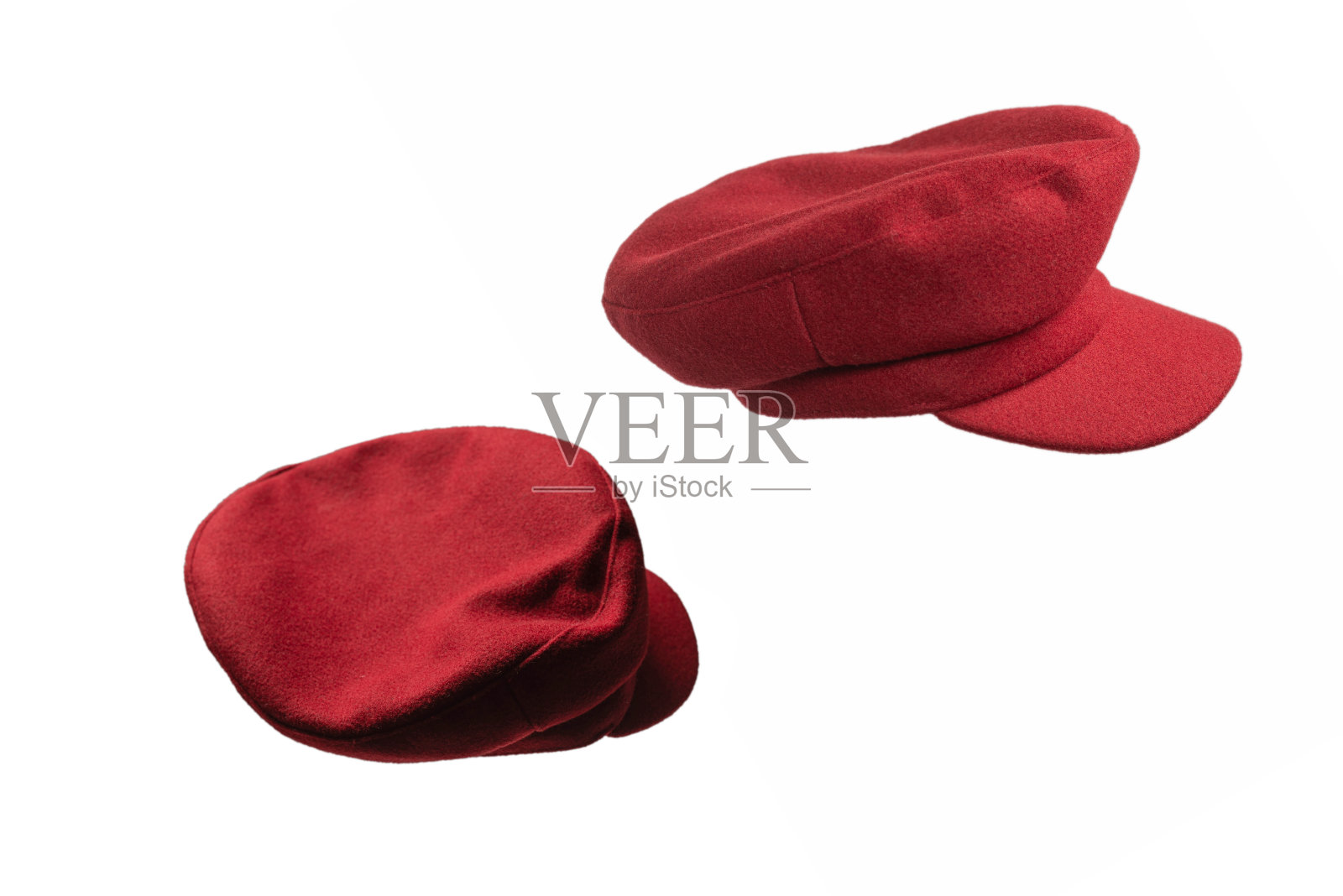 女红帽与遮阳板隔离在白色背景。照片摄影图片