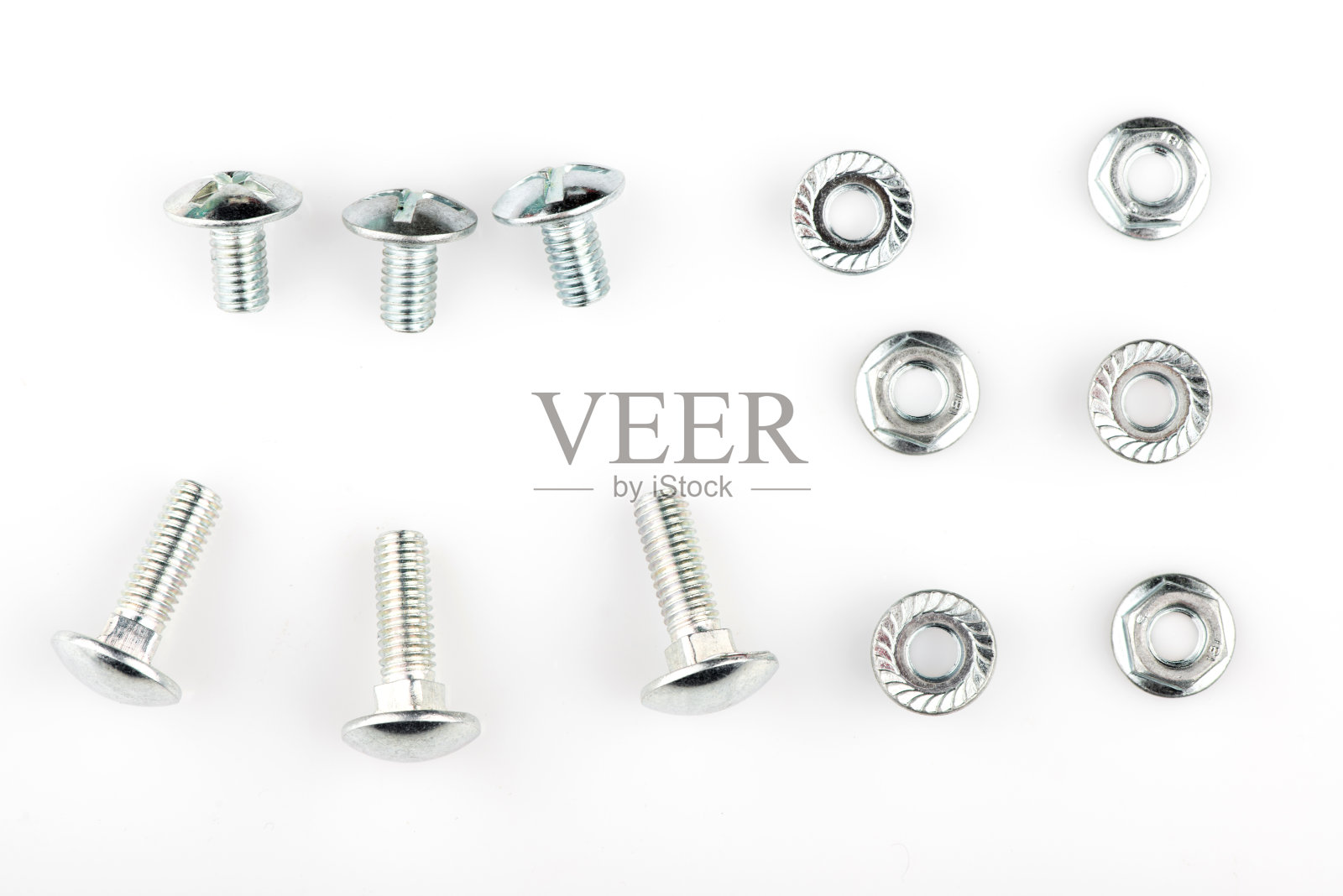 白色背景上的螺丝和螺母照片摄影图片