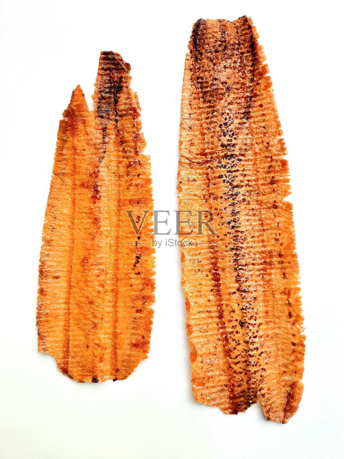 脆皮烤鱿鱼-海鲜小吃。照片摄影图片