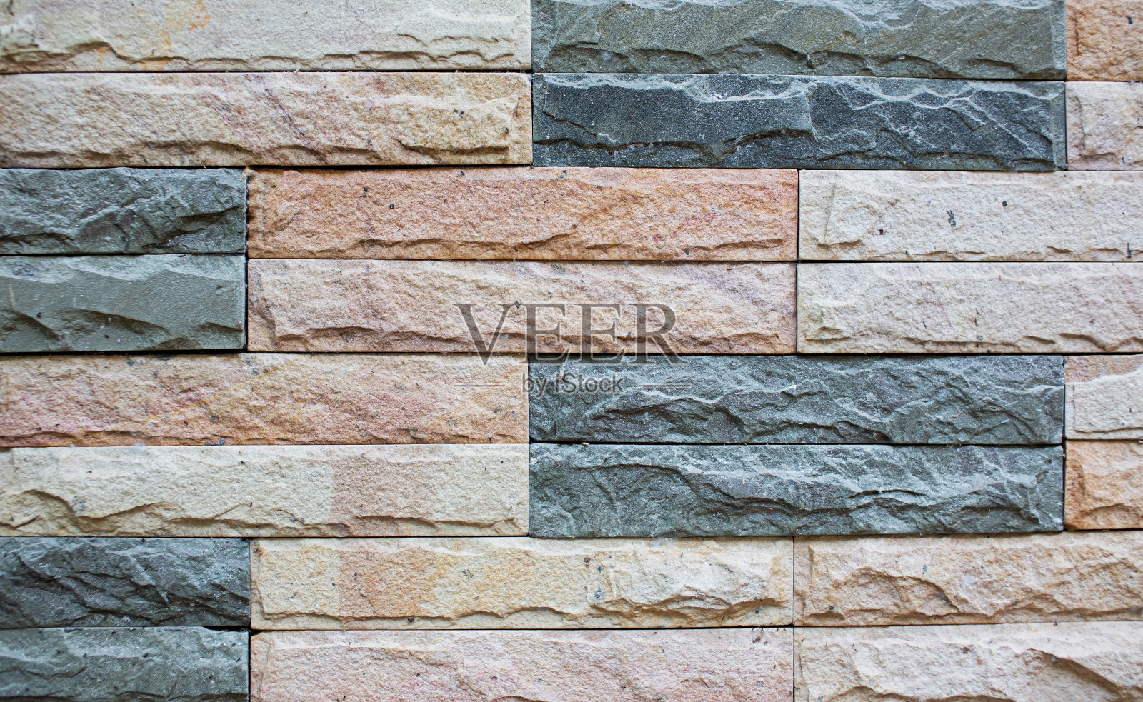 砖块的灰色图案和粗糙的砂岩墙的纹理和背景照片摄影图片