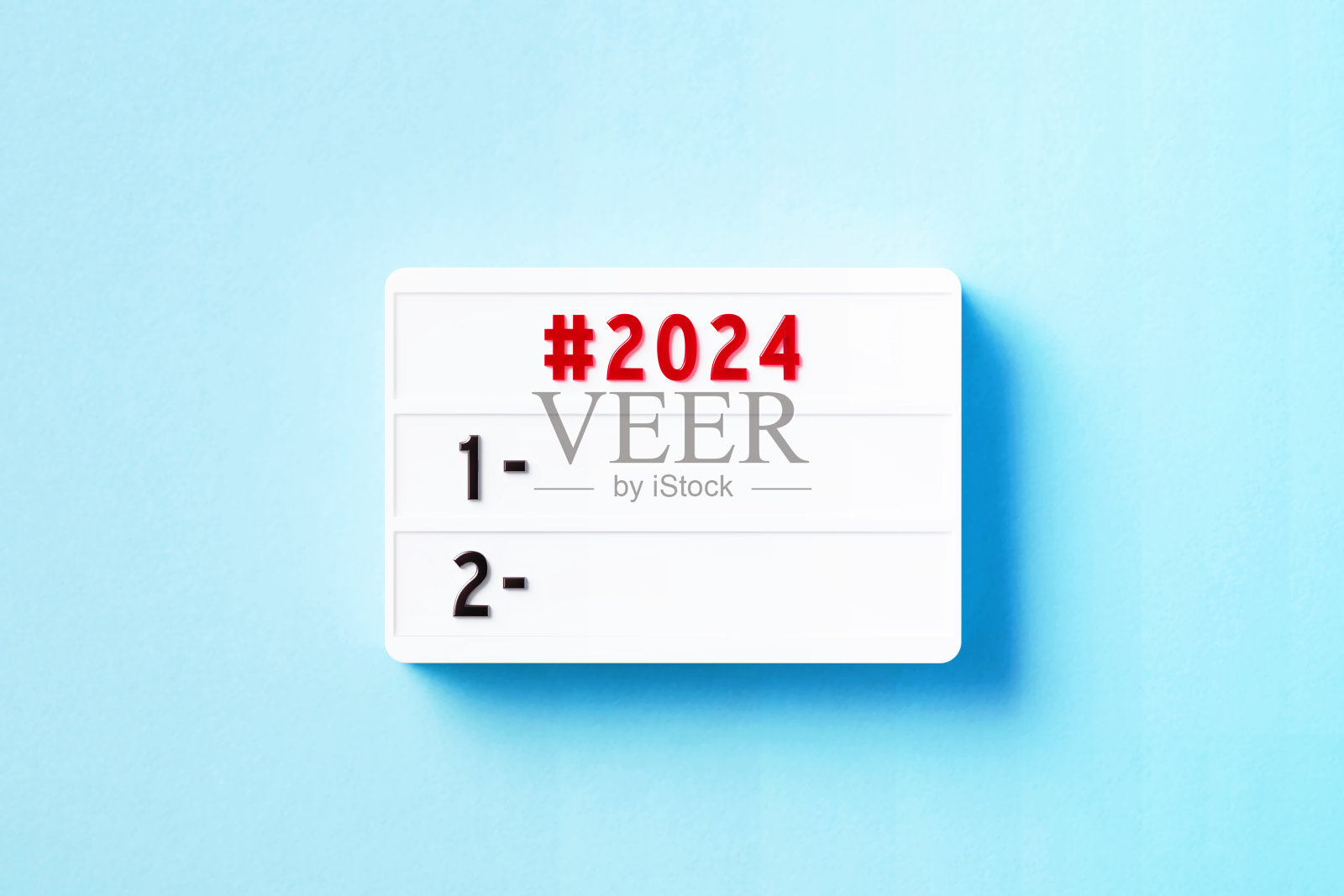 2024清单白色灯箱放在蓝色背景上照片摄影图片