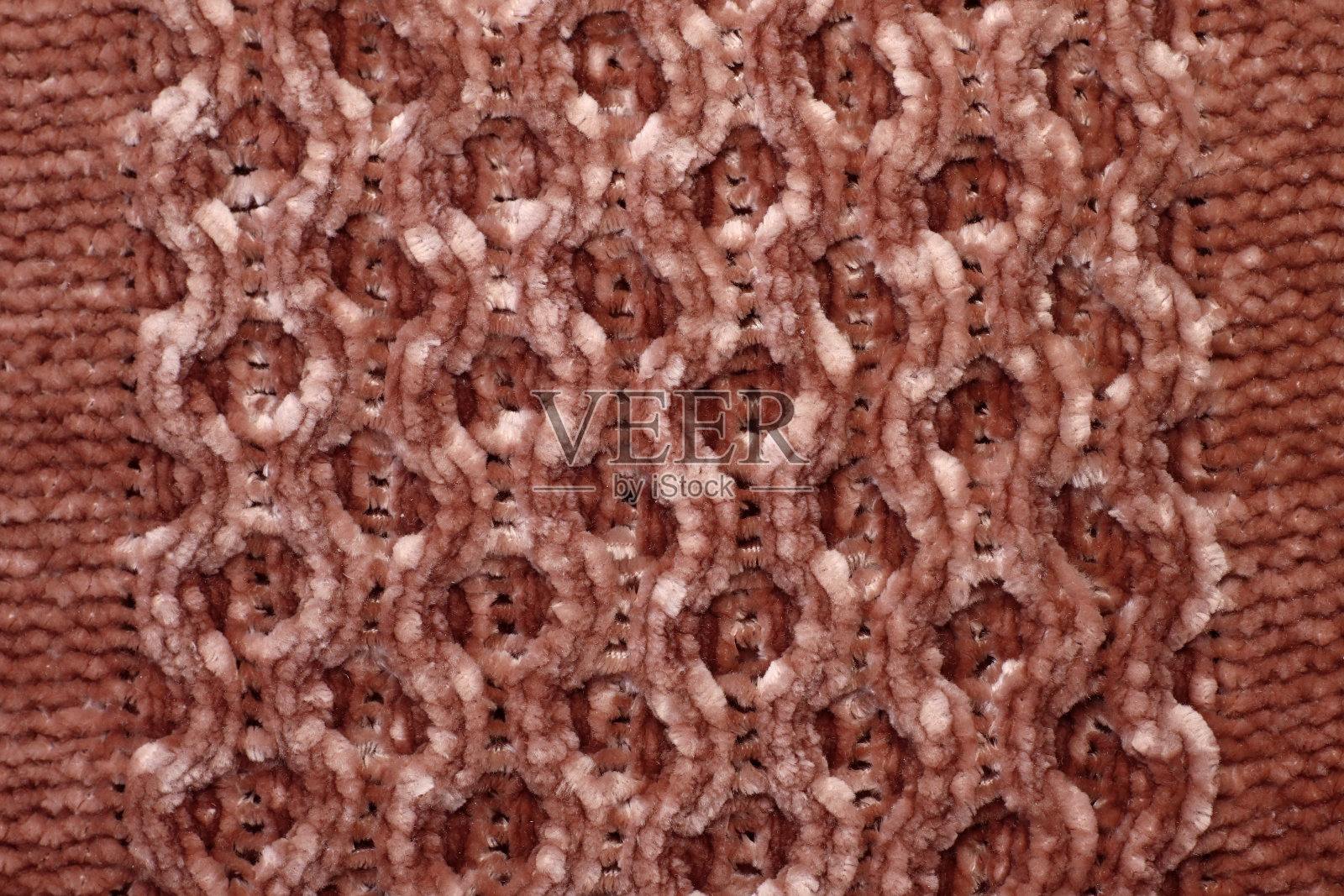 柔光自然质感的针织羊毛纺织材料背景。棕色钩针棉织物编织帆布照片摄影图片