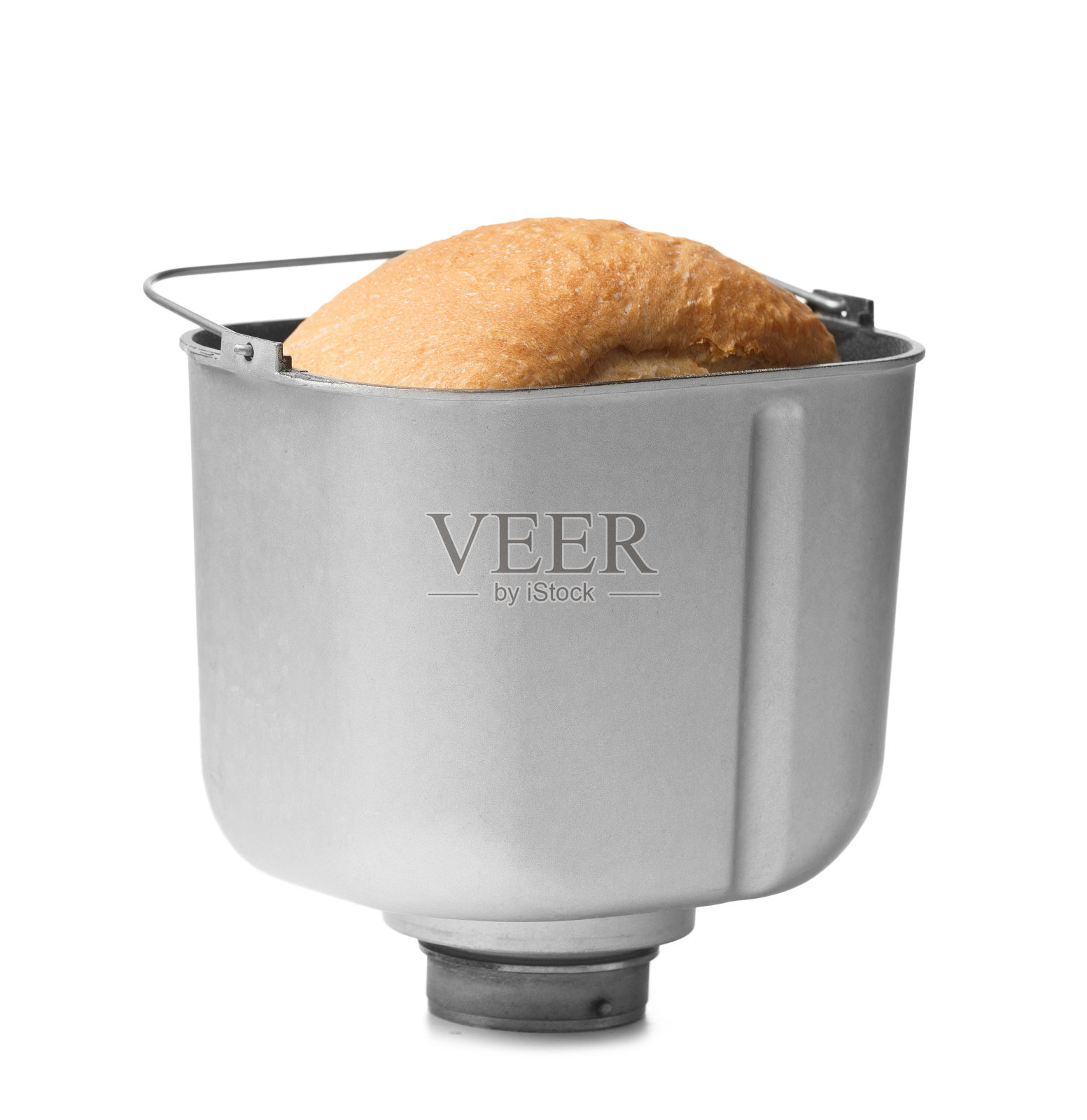 用面包机在白底的烤盘里自制的面包。照片摄影图片