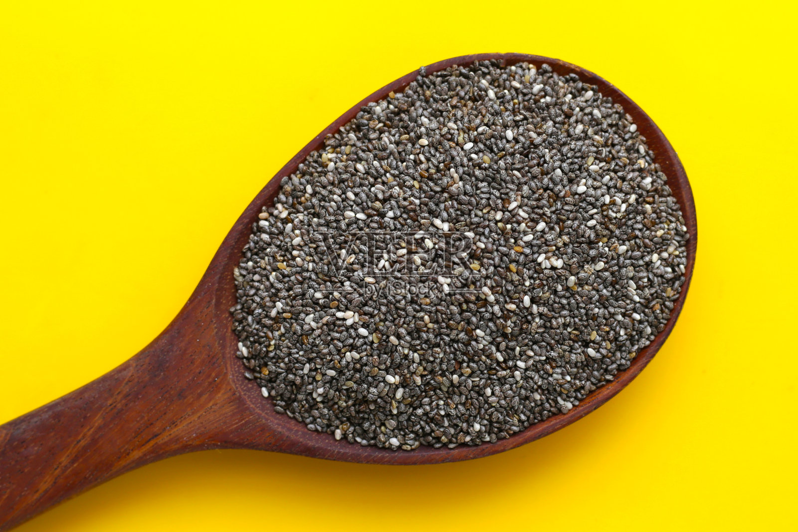 黄底奇亚籽。照片摄影图片