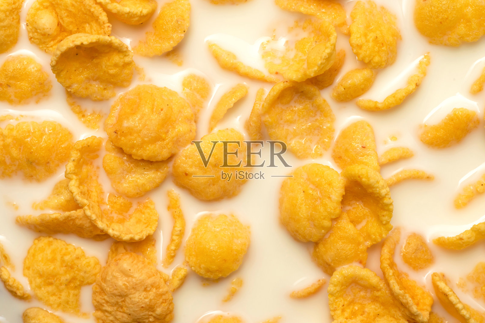 牛奶玉米片的背景和质地。早上的早餐照片摄影图片