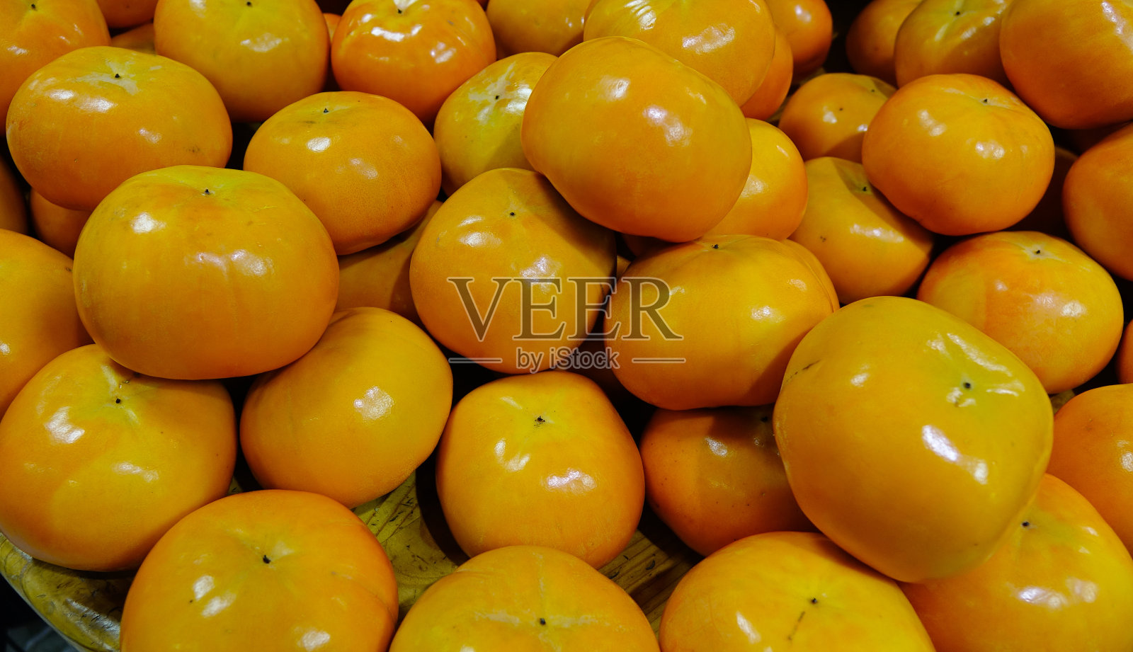 农贸市场的柿子照片摄影图片