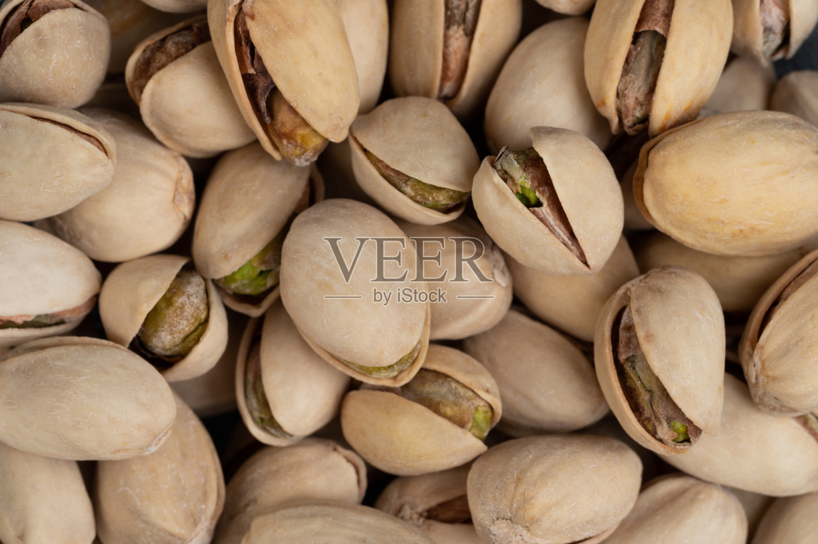 咸棕色裂开心果照片摄影图片