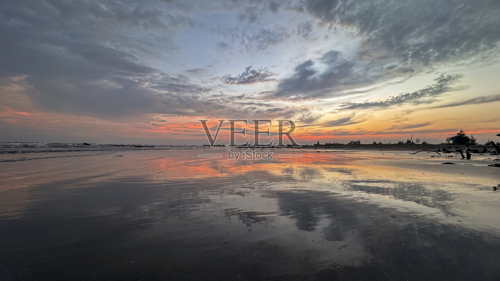 娇峰海滩的日落照片摄影图片