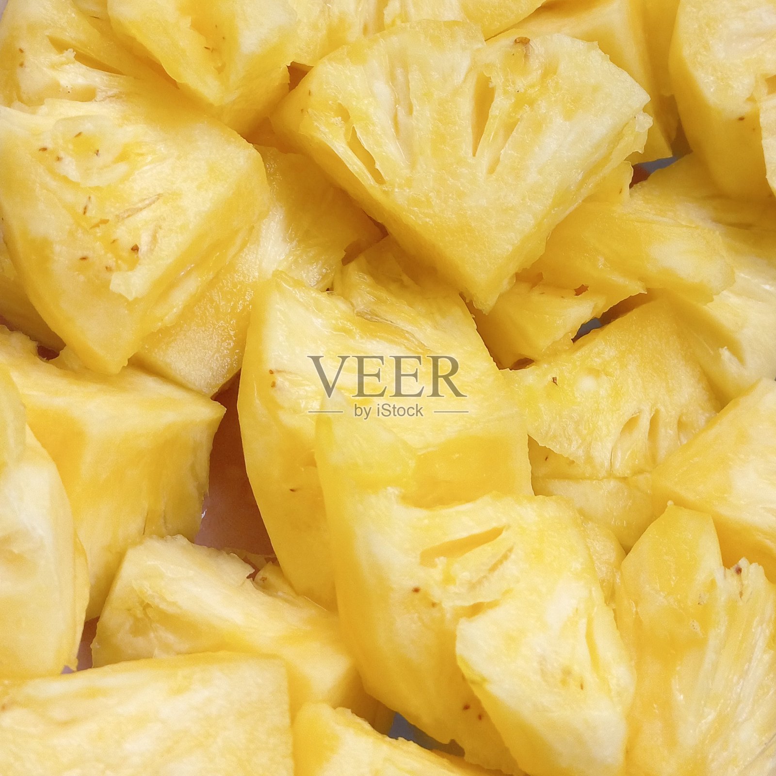 鲜菠萝片，色泽金黄明亮照片摄影图片