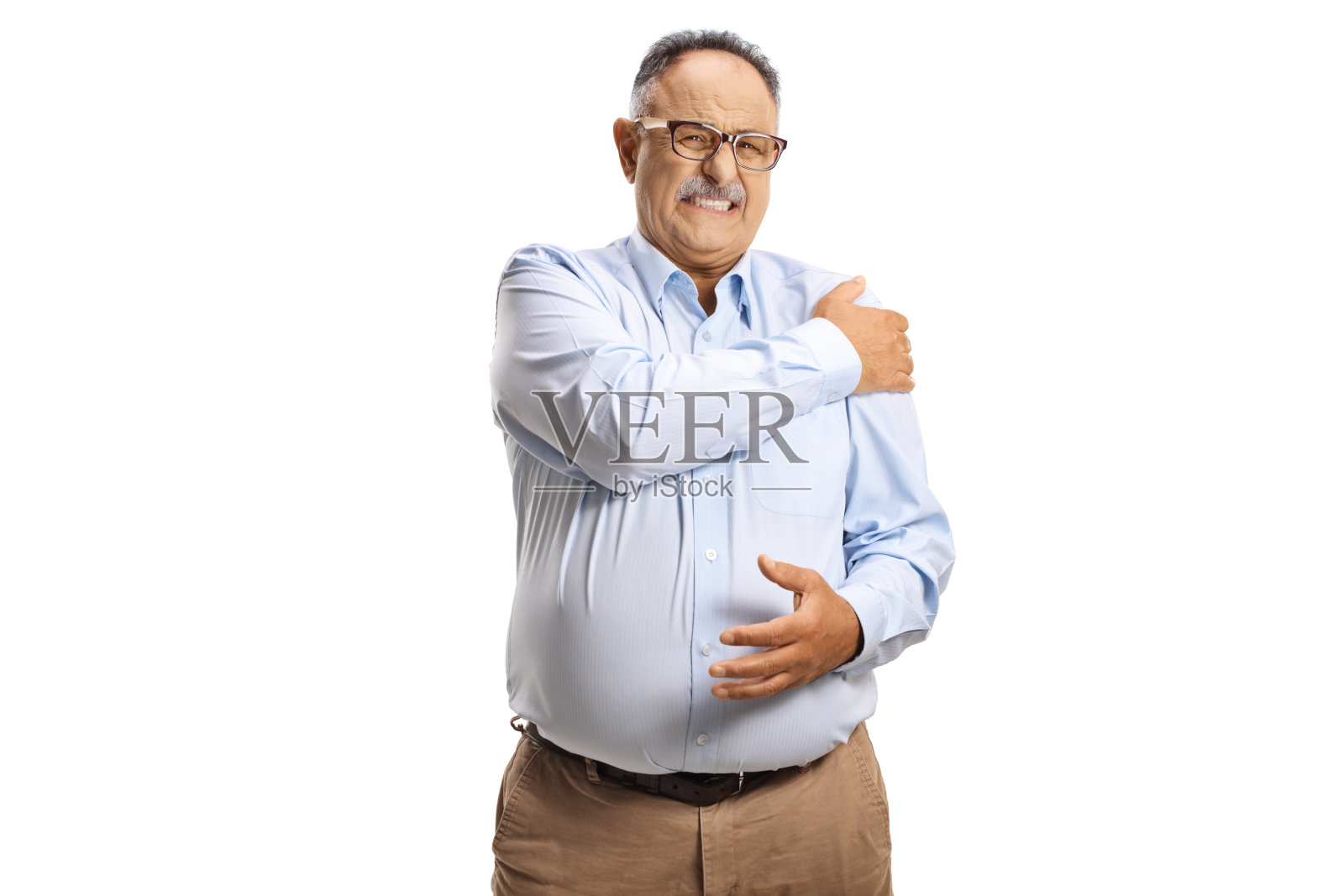 捂着肩膀看着镜头的痛苦中年男人照片摄影图片