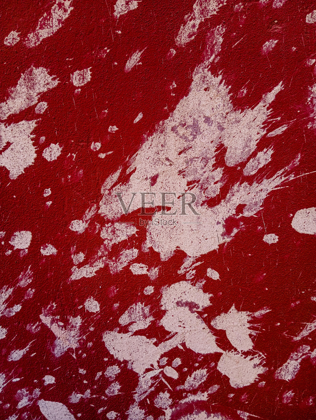 红色水泥墙很脏，有油漆渍。抽象油漆垃圾背景。照片摄影图片