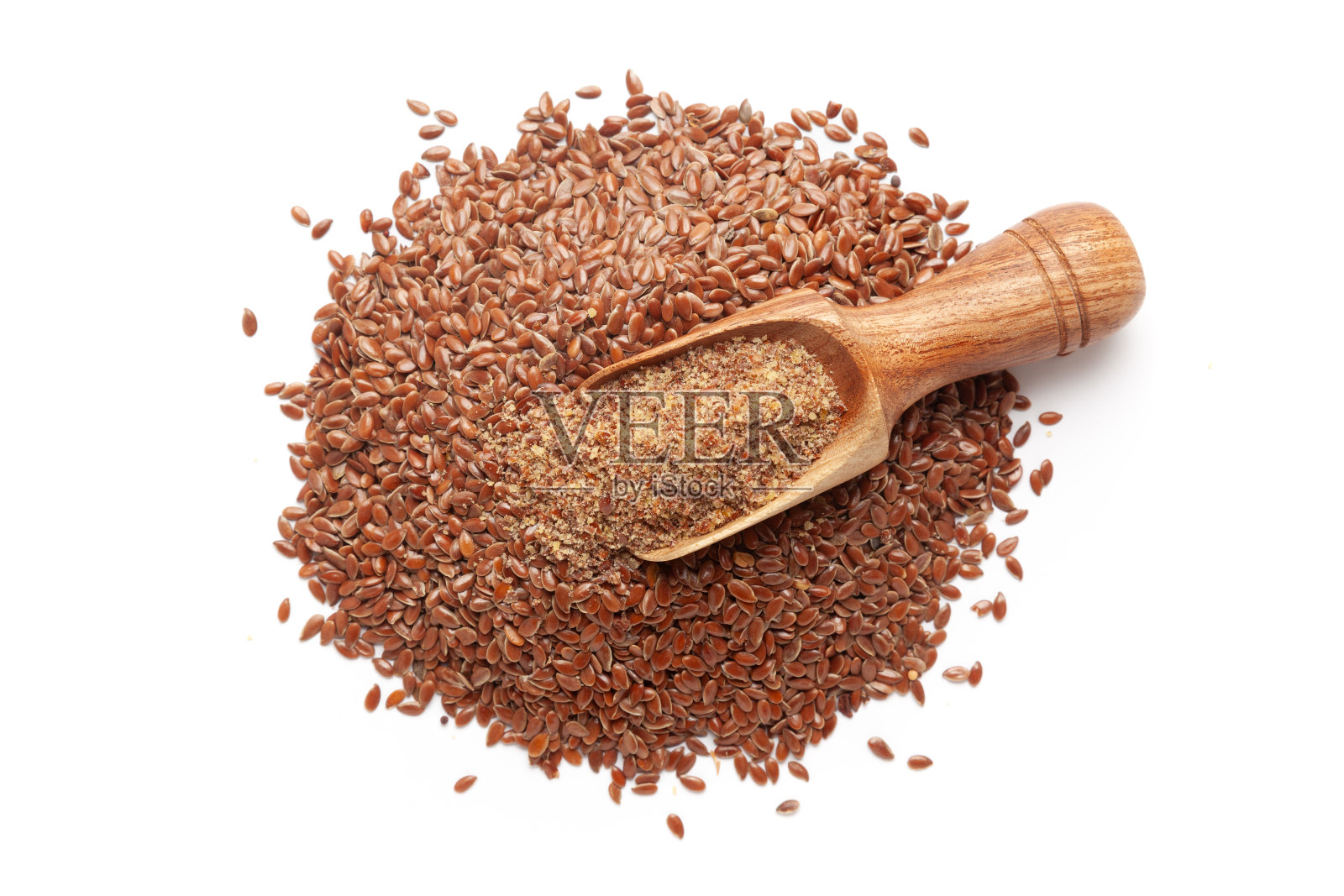 木勺的俯视图装满了有机亚麻籽(亚麻籽)面粉。照片摄影图片